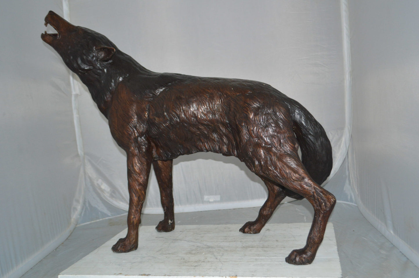 Howling Wolf Bronze Statue -  Size: 40"L x 10"W x 32"H.