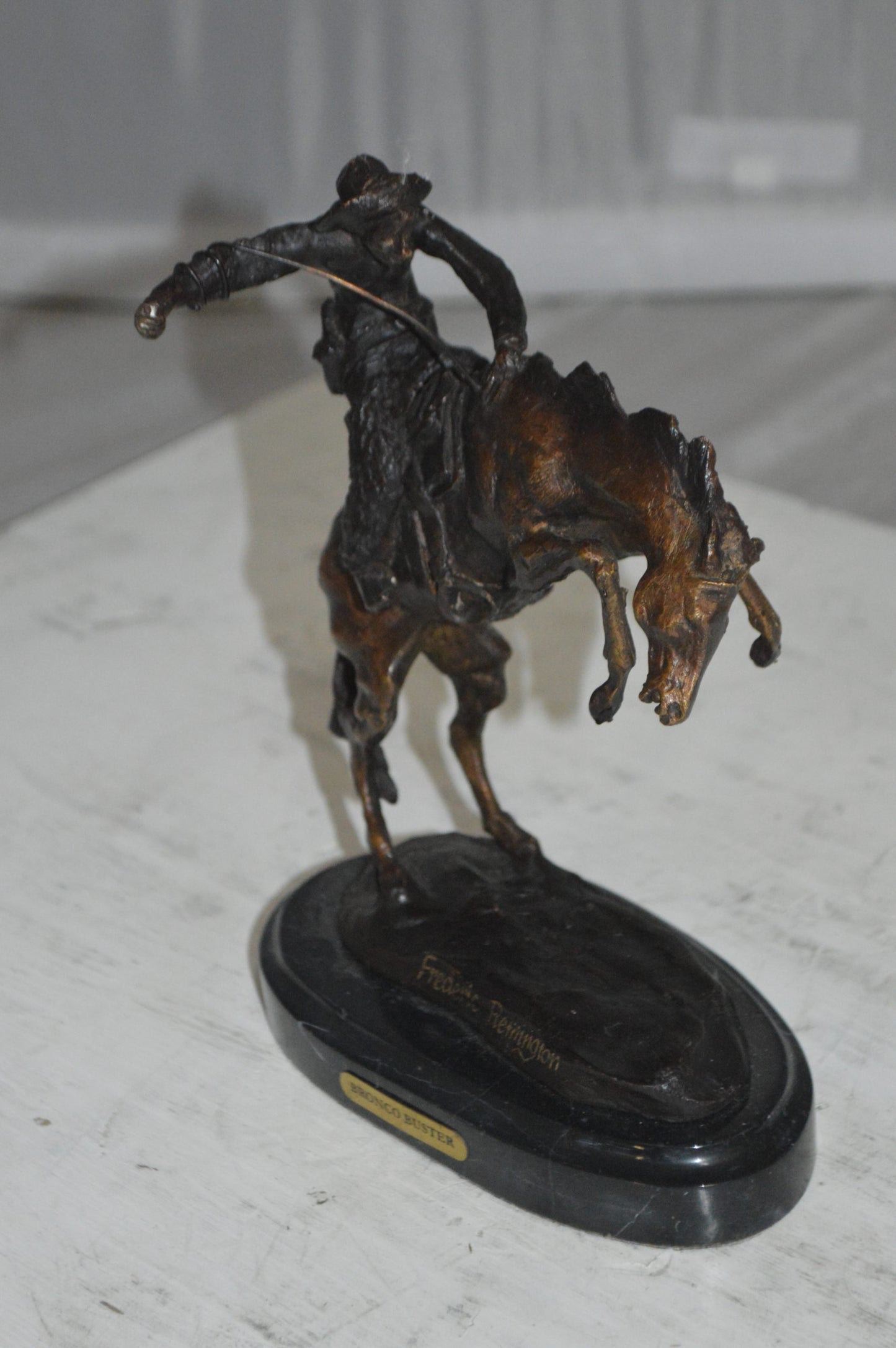 Bronco Buster by Remington Bronze Statue -  3" x 7" x 10"H. 