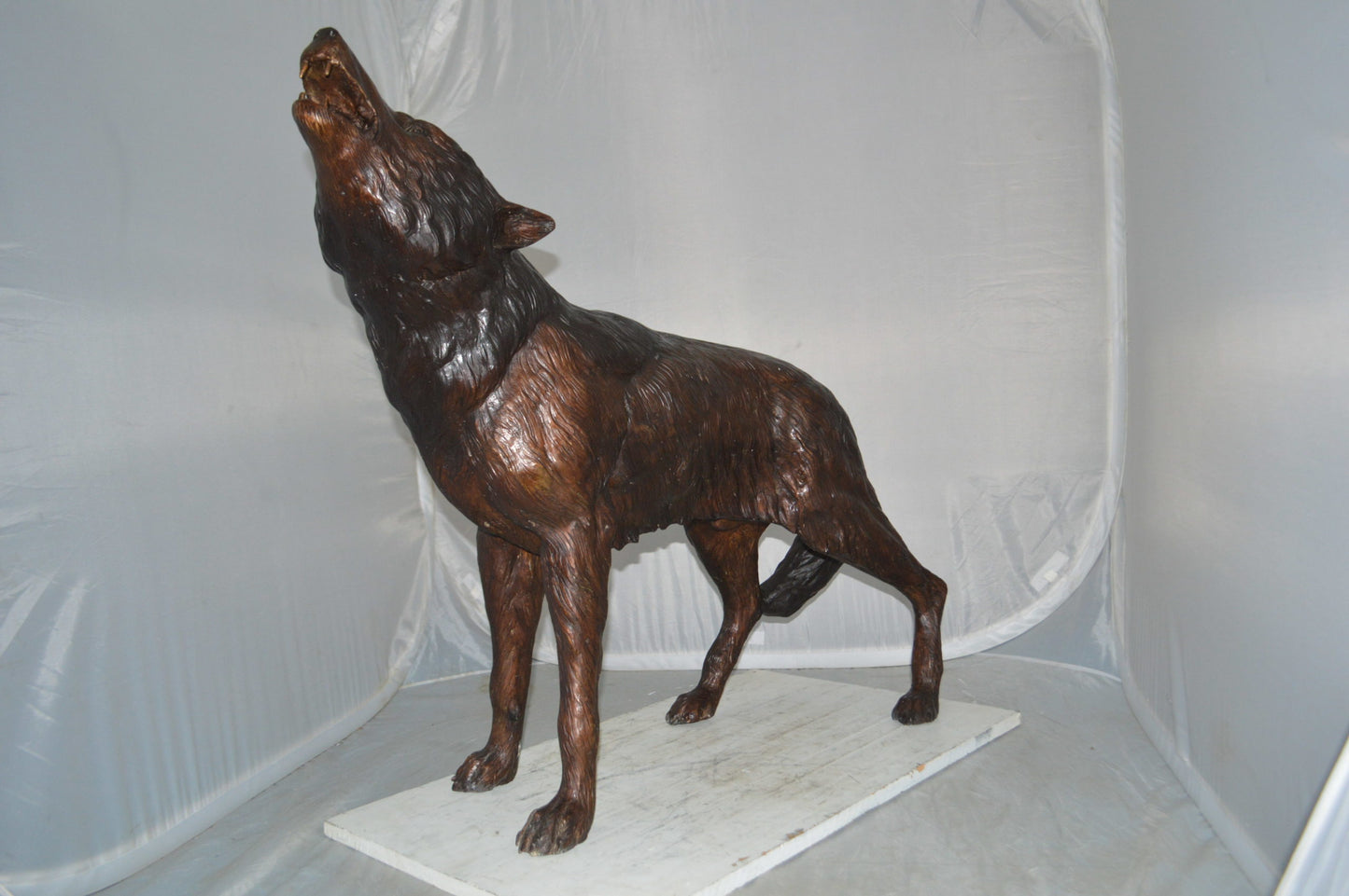 Howling Wolf Bronze Statue -  Size: 40"L x 10"W x 32"H.