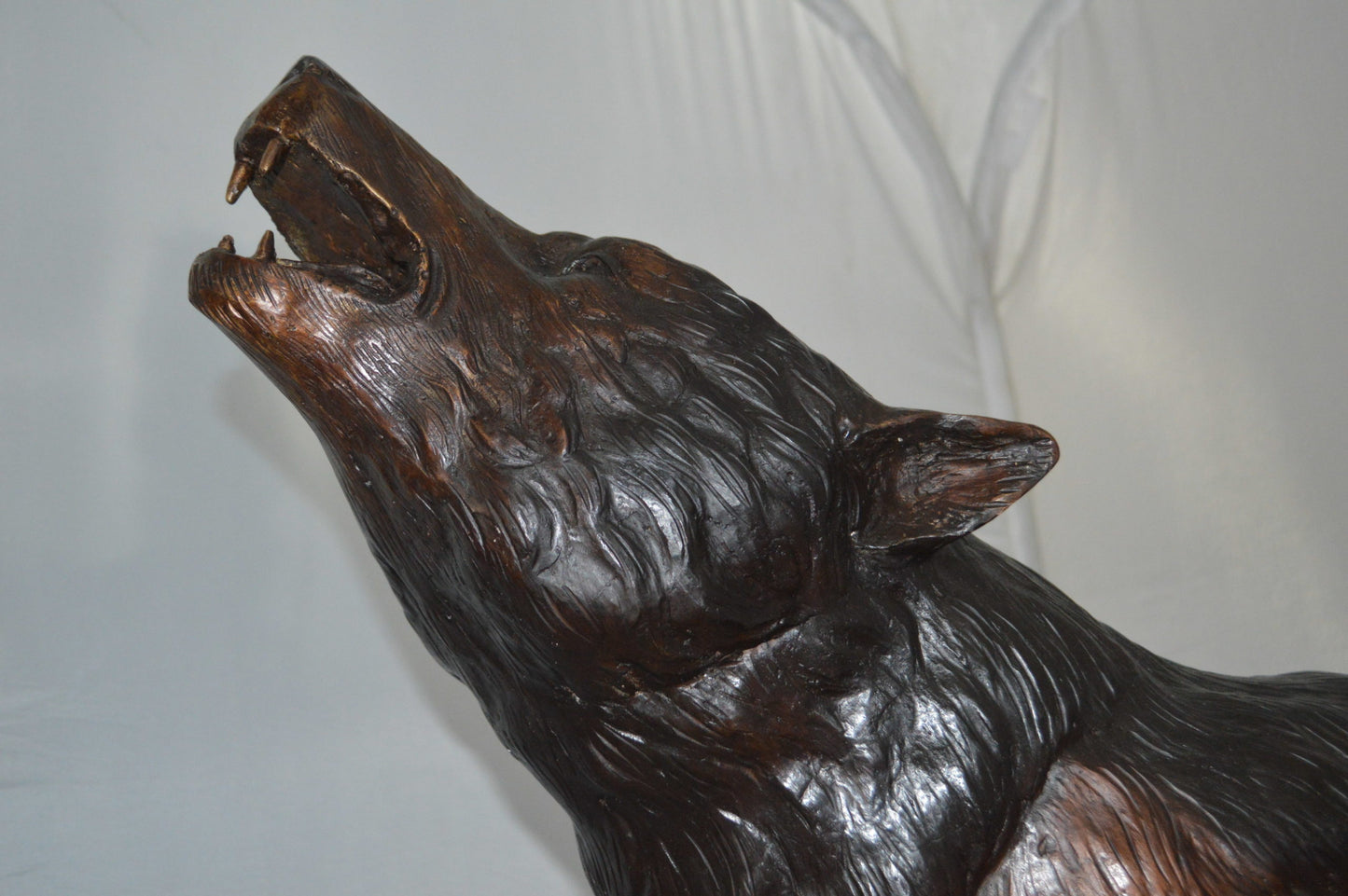 Howling Wolf Bronze Statue -  Size: 40"L x 10"W x 32"H.