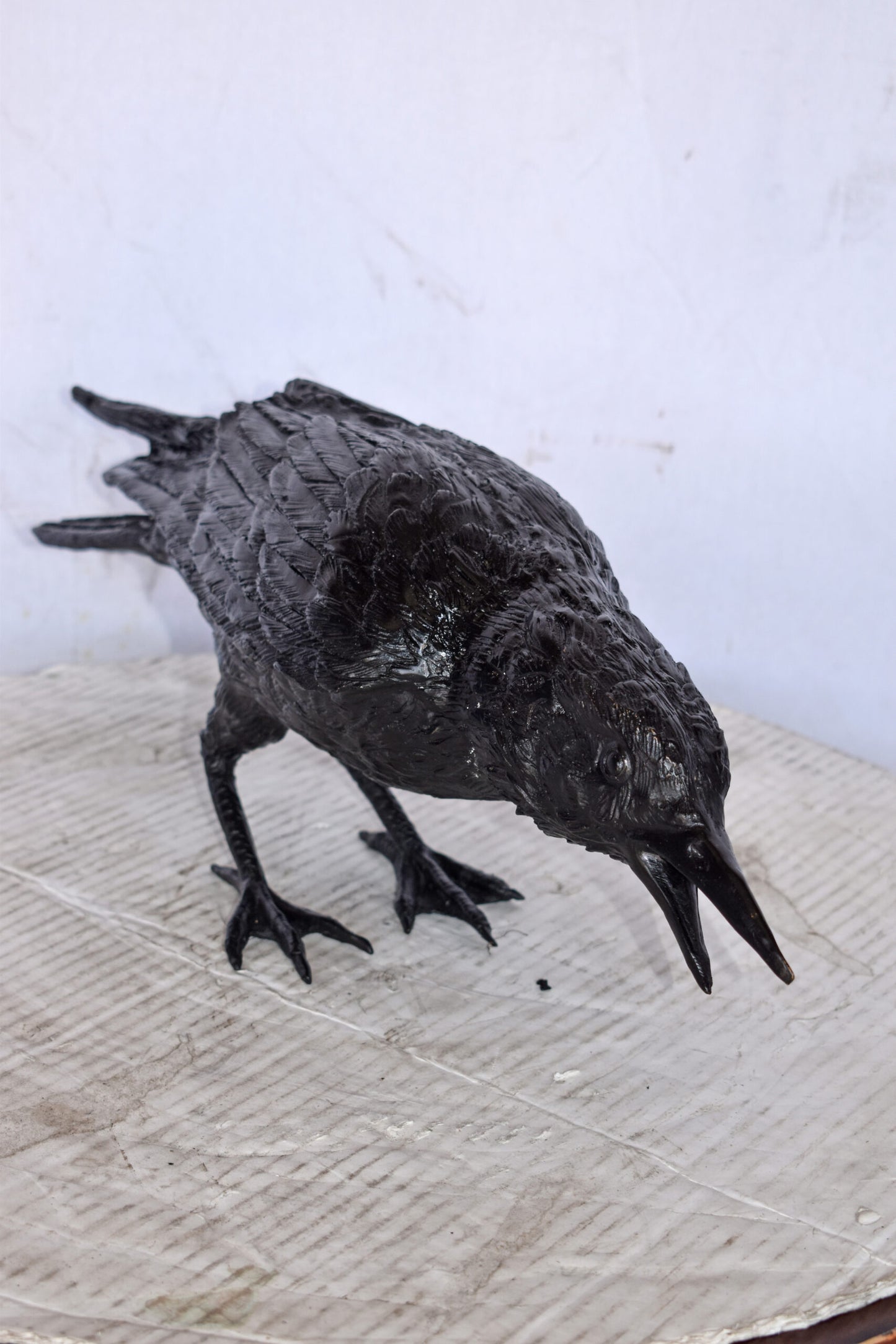 Raven Looking for Food Bronze State - Size: 24"L x 6"W x 12"H.