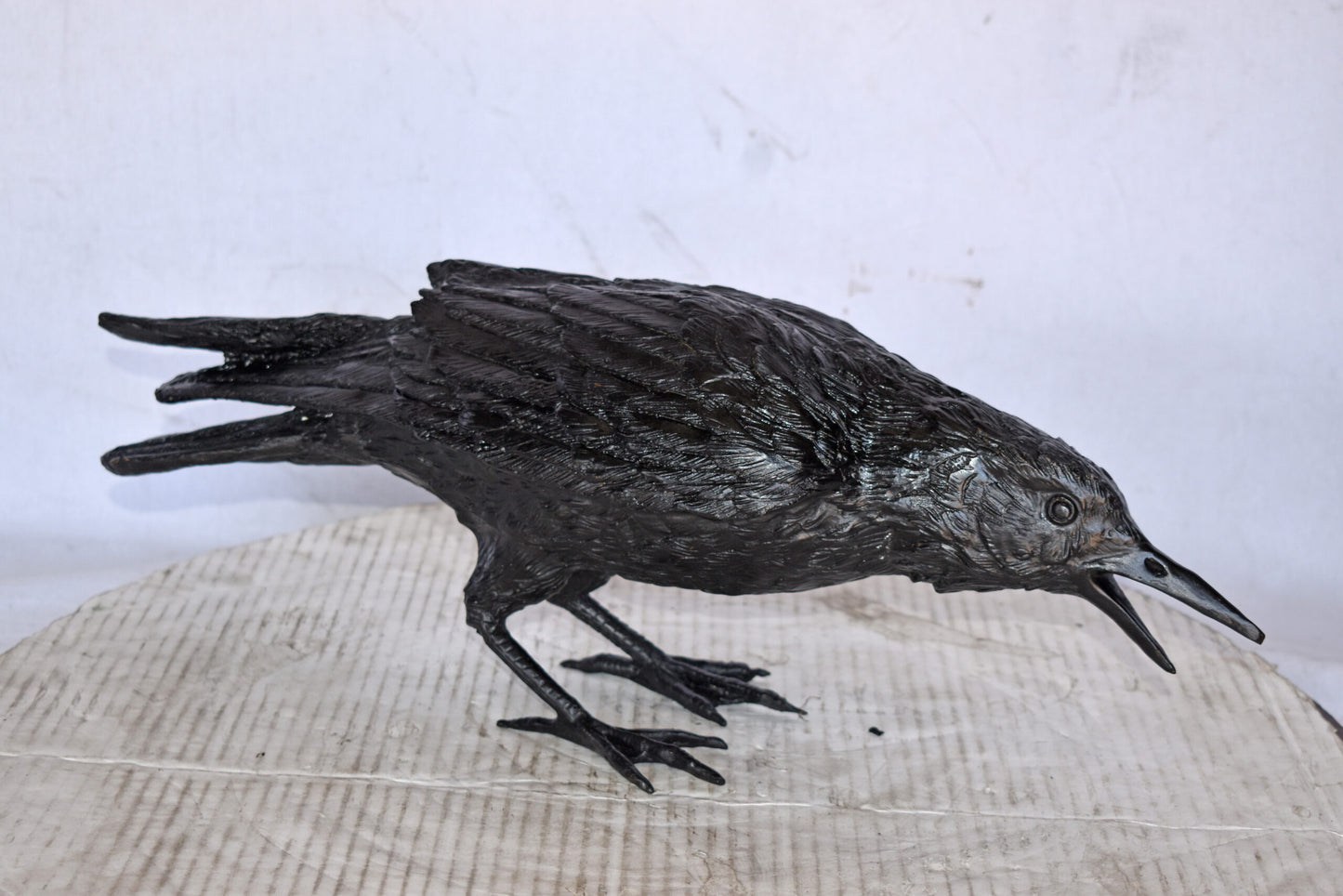Raven Looking for Food Bronze State - Size: 24"L x 6"W x 12"H.