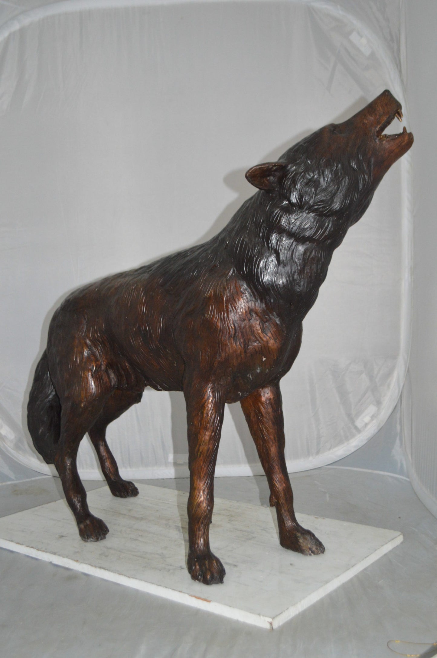 Howling Wolf Bronze Statue -  Size: 40"L x 10"W x 32"H.