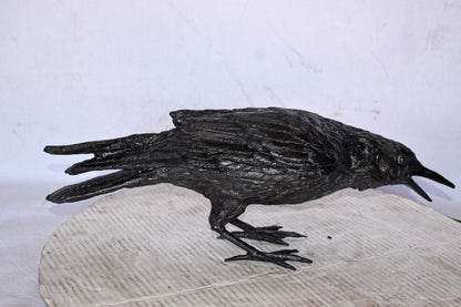 Raven Looking for Food Bronze State - Size: 24"L x 6"W x 12"H.