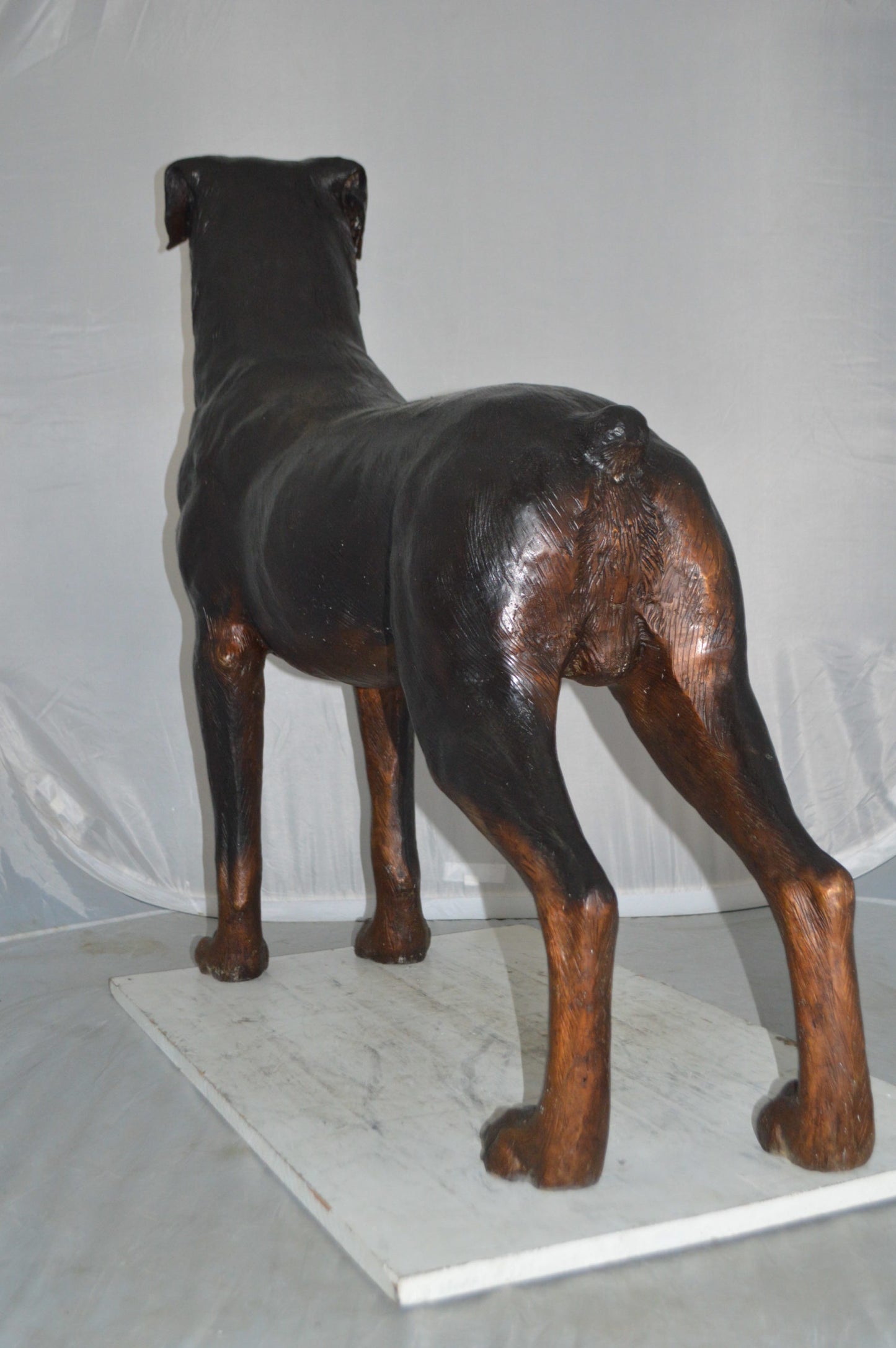 Rottweiler Dog Bronze Statue -  Size: 44"L x 10"W x 36"H.