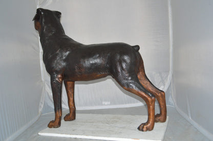 Rottweiler Dog Bronze Statue -  Size: 44"L x 10"W x 36"H.