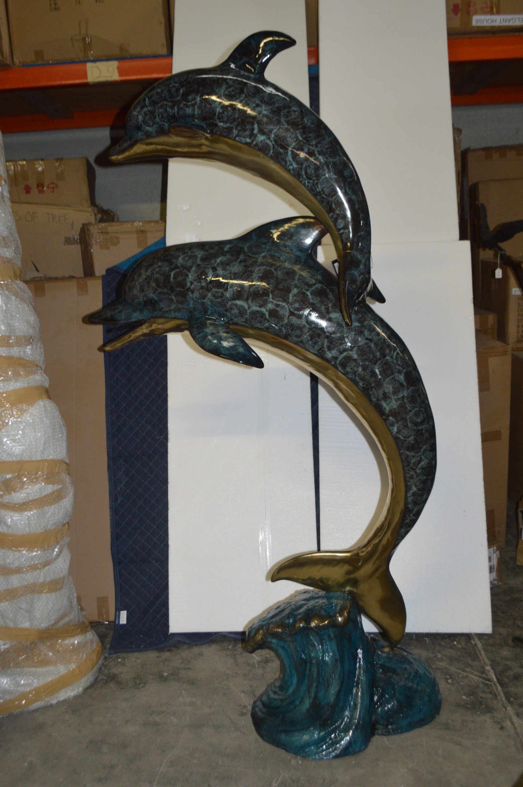 Two Dolphins Overreach Others on Waves Bronze Statue -  44"L x 23"W x 76"H. 