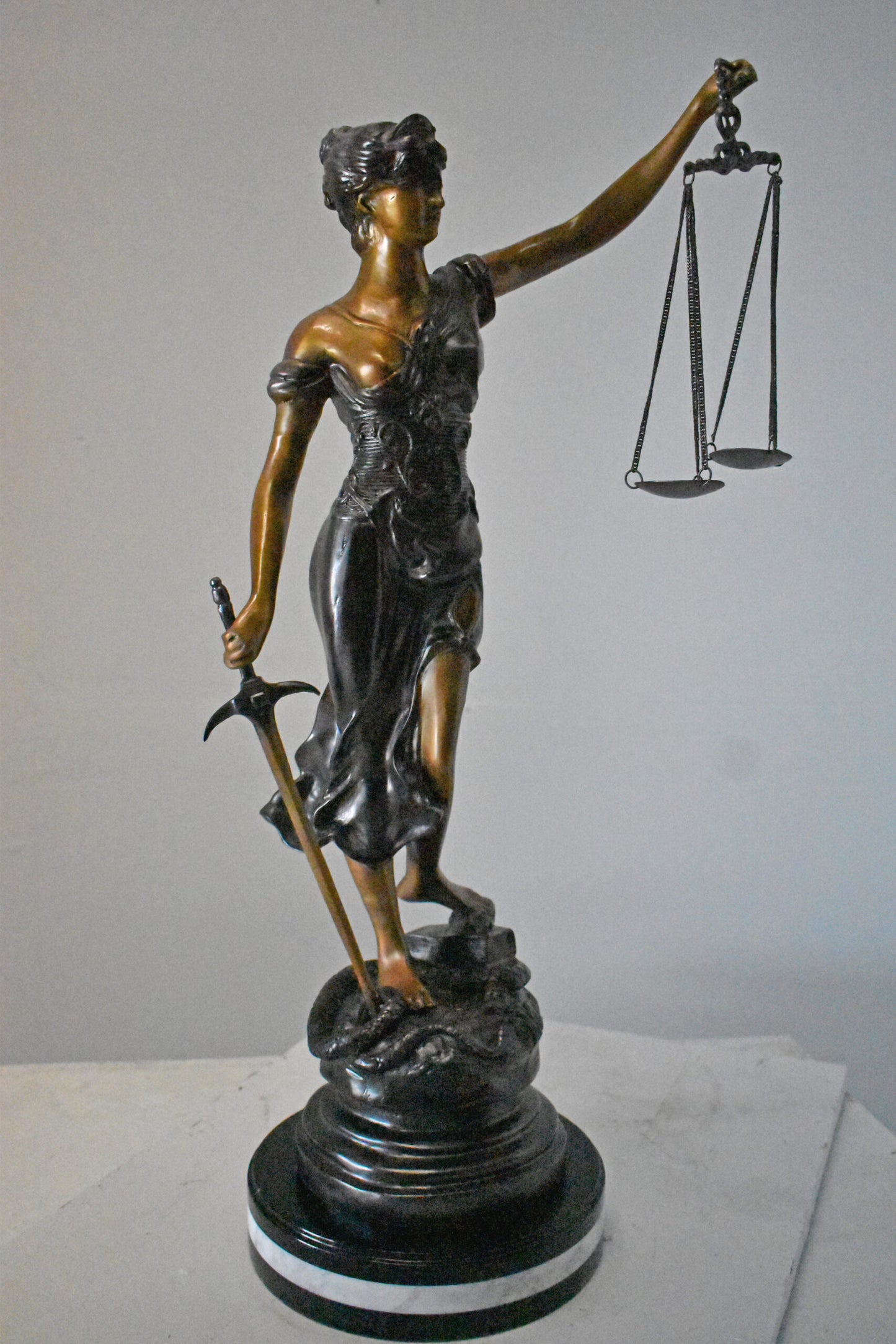 Lady Justice bronze statue mounted on a marble - Size: 14"L x 16"W x 32"H.