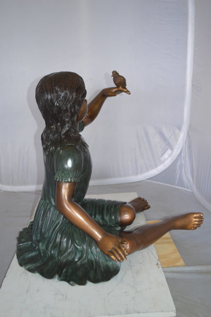 Girl with a Sparrow Bronze Statue -  Size: 24"L x 30"W x 25"H. 