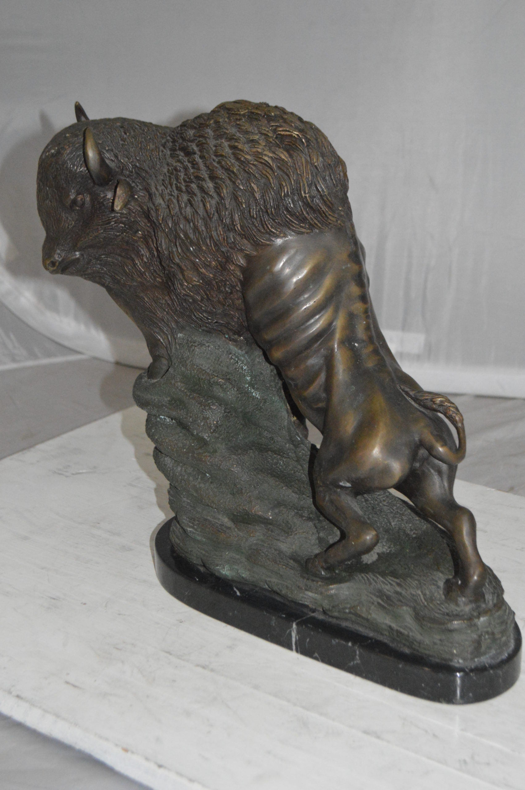 Bison Bronze Statue -  Size: 7"L x 14"W x 15"H. 