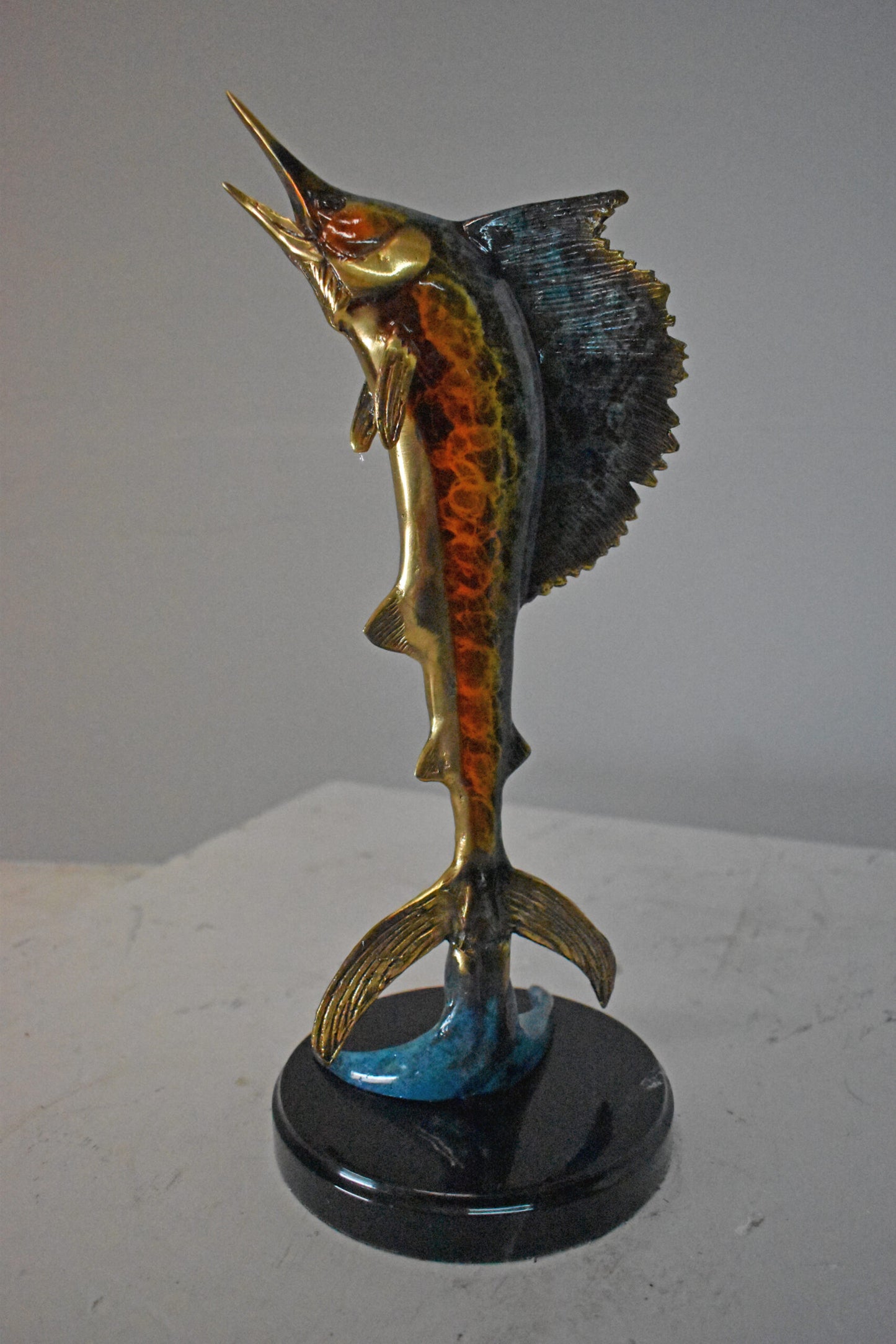 Single Sailfish Bronze Statue Mounted on Round Marble - Size: 6"L x 6"W x 15"H.