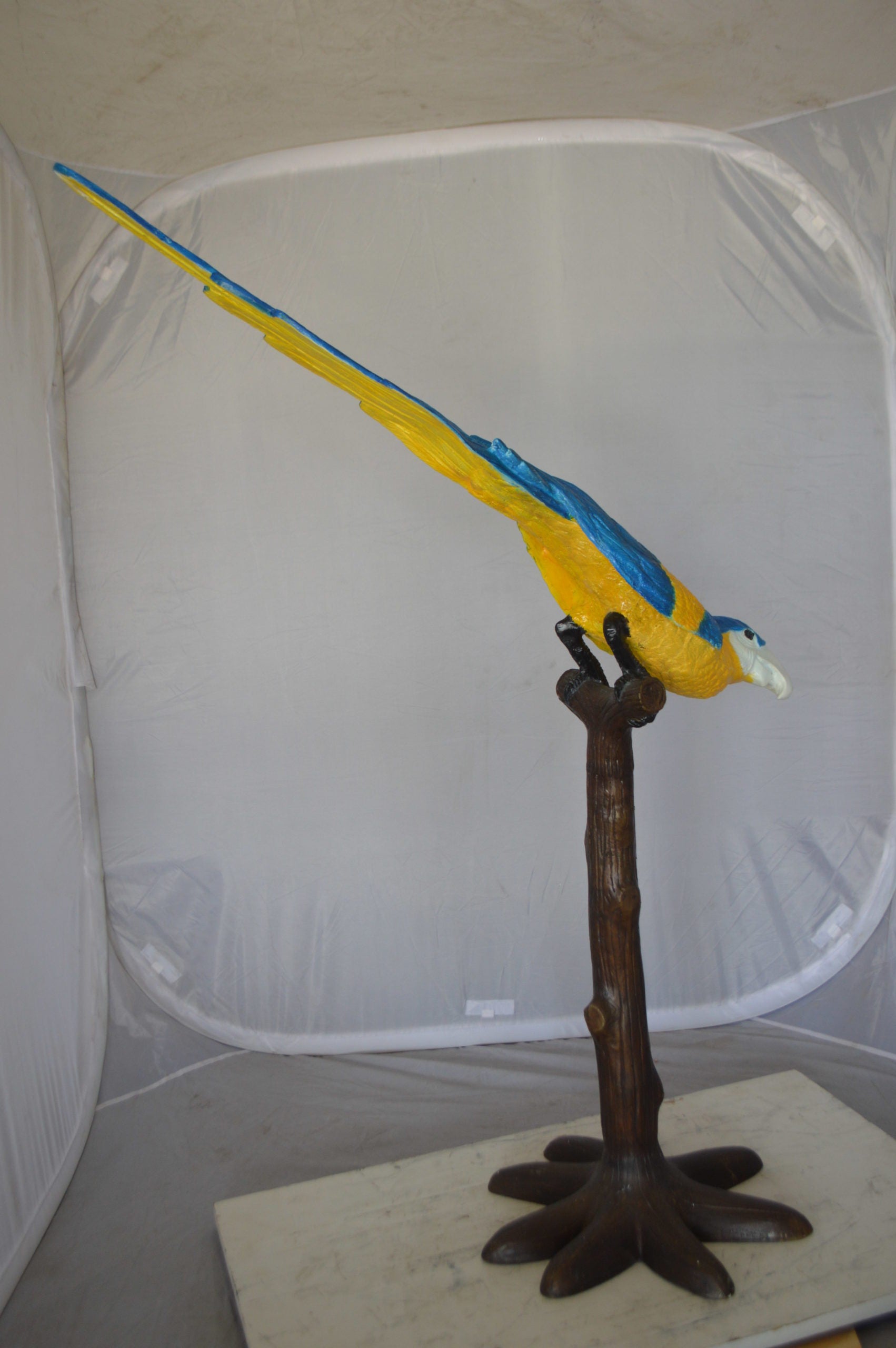 Parrot on Tree - Head Down Bronze Statue -  Size: 39"L x 15"W x 47"H. 