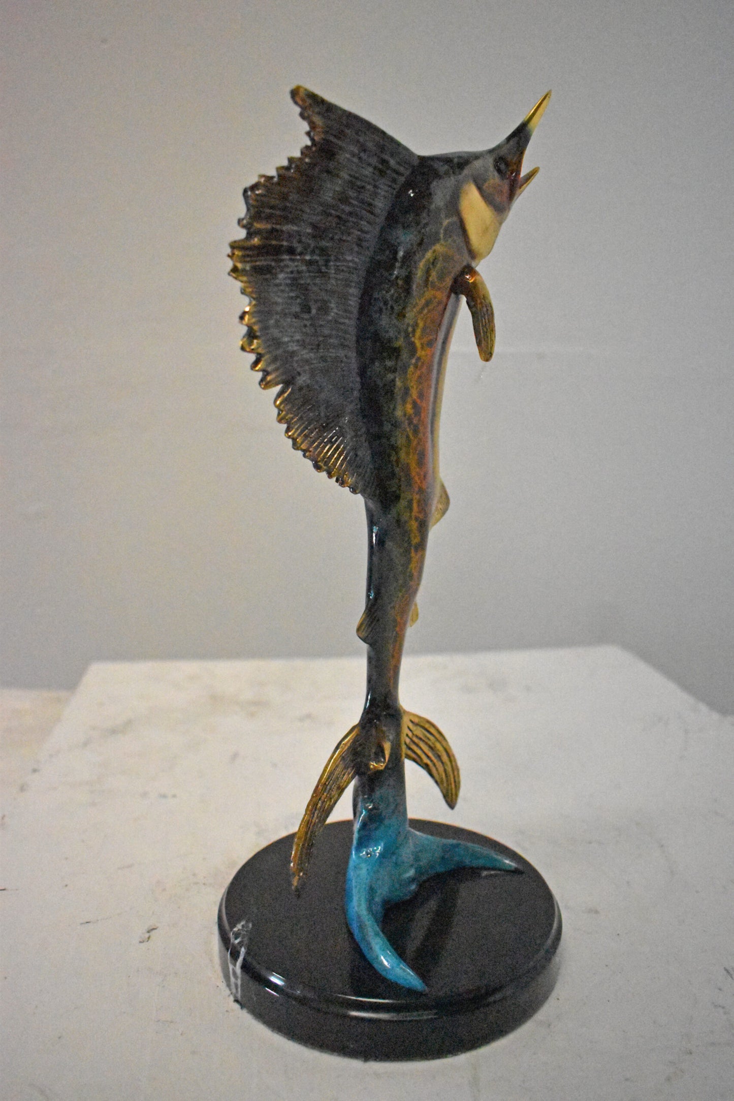 Single Sailfish Bronze Statue Mounted on Round Marble - Size: 6"L x 6"W x 15"H.