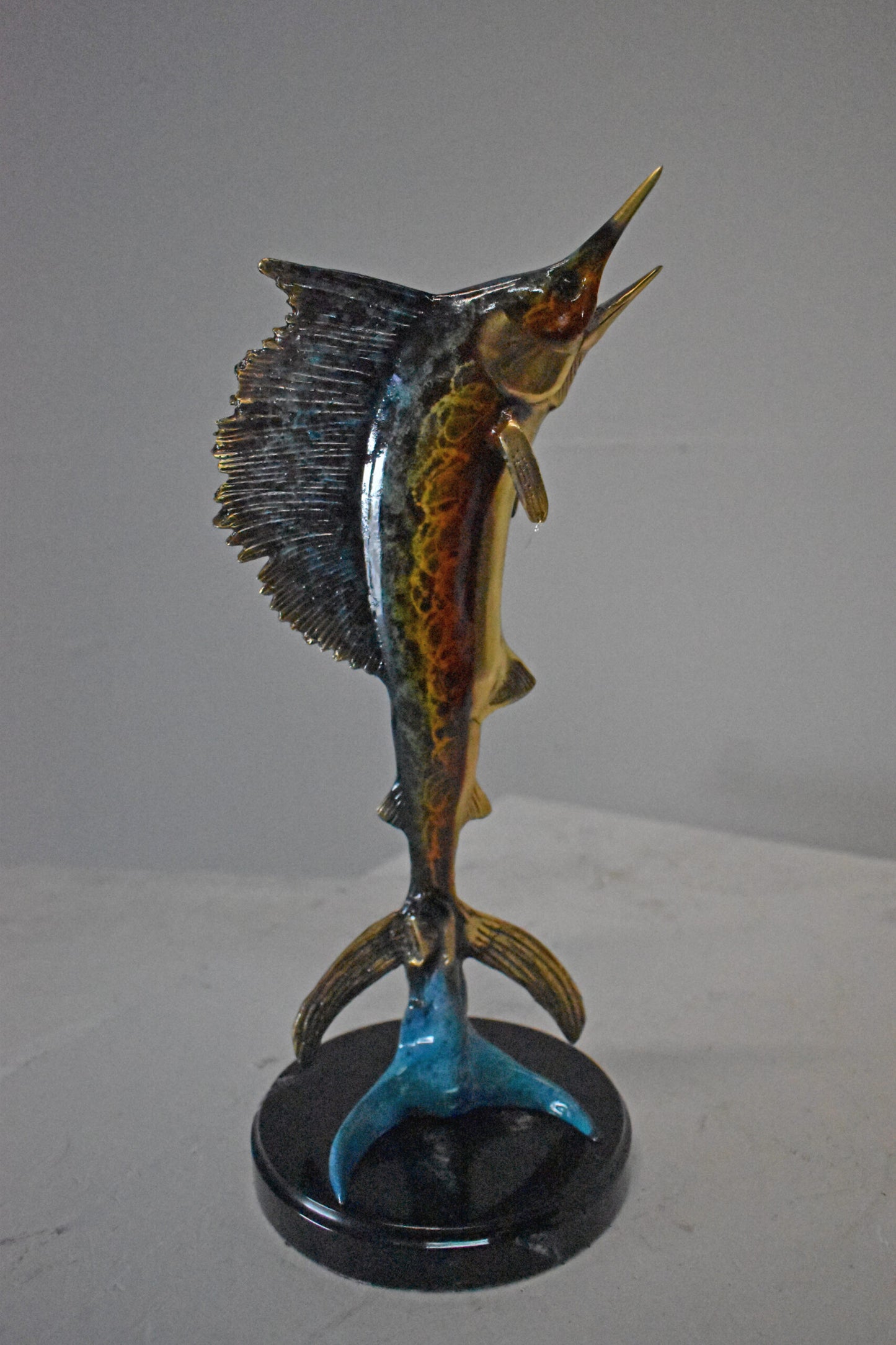 Single Sailfish Bronze Statue Mounted on Round Marble - Size: 6"L x 6"W x 15"H.