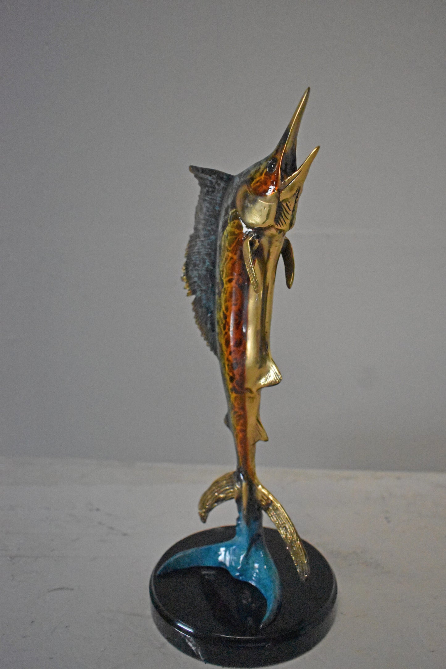 Single Sailfish Bronze Statue Mounted on Round Marble - Size: 6"L x 6"W x 15"H.