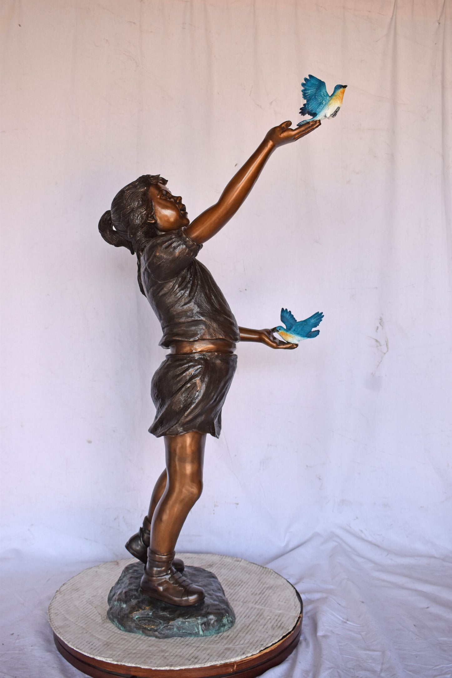 Girl, sandy, with two Blue birds Bronze Statue - Size: 25"L x 23"W x 41"H.