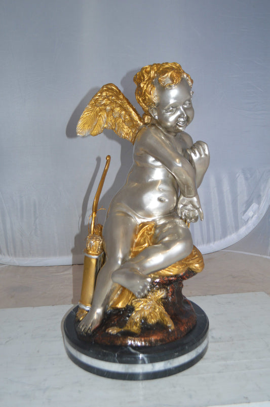 Cupid Girl On A Rock Bronze Statue  -  Size: 20"L x 15"W x 25"H. 