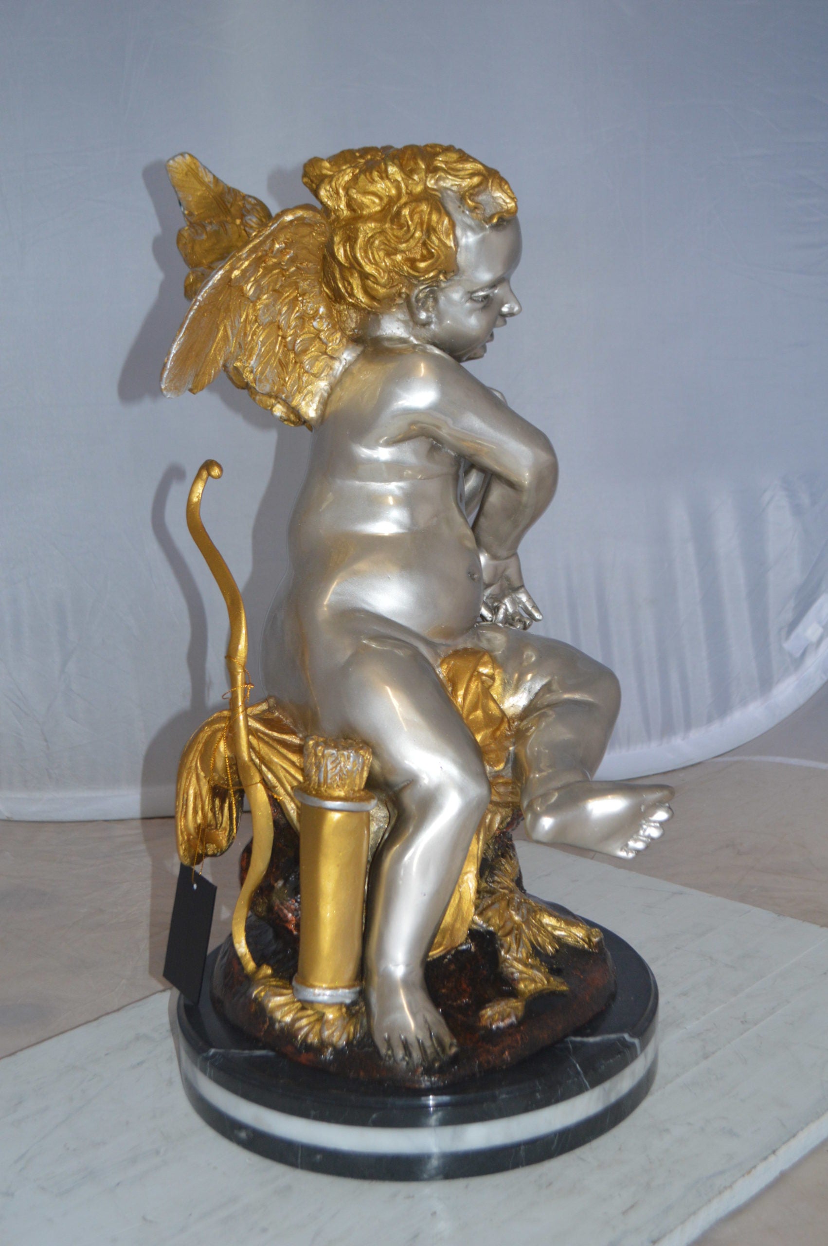Cupid Girl On A Rock Bronze Statue  -  Size: 20"L x 15"W x 25"H. 