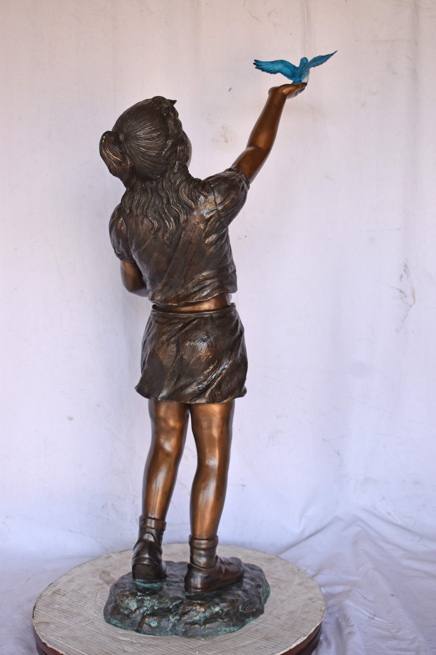 Girl, sandy, with two Blue birds Bronze Statue - Size: 25"L x 23"W x 41"H.