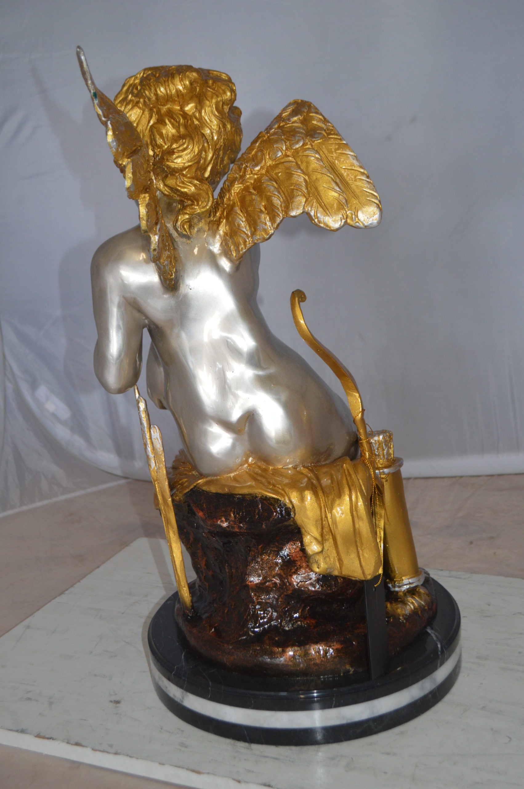 Cupid Girl On A Rock Bronze Statue  -  Size: 20"L x 15"W x 25"H. 