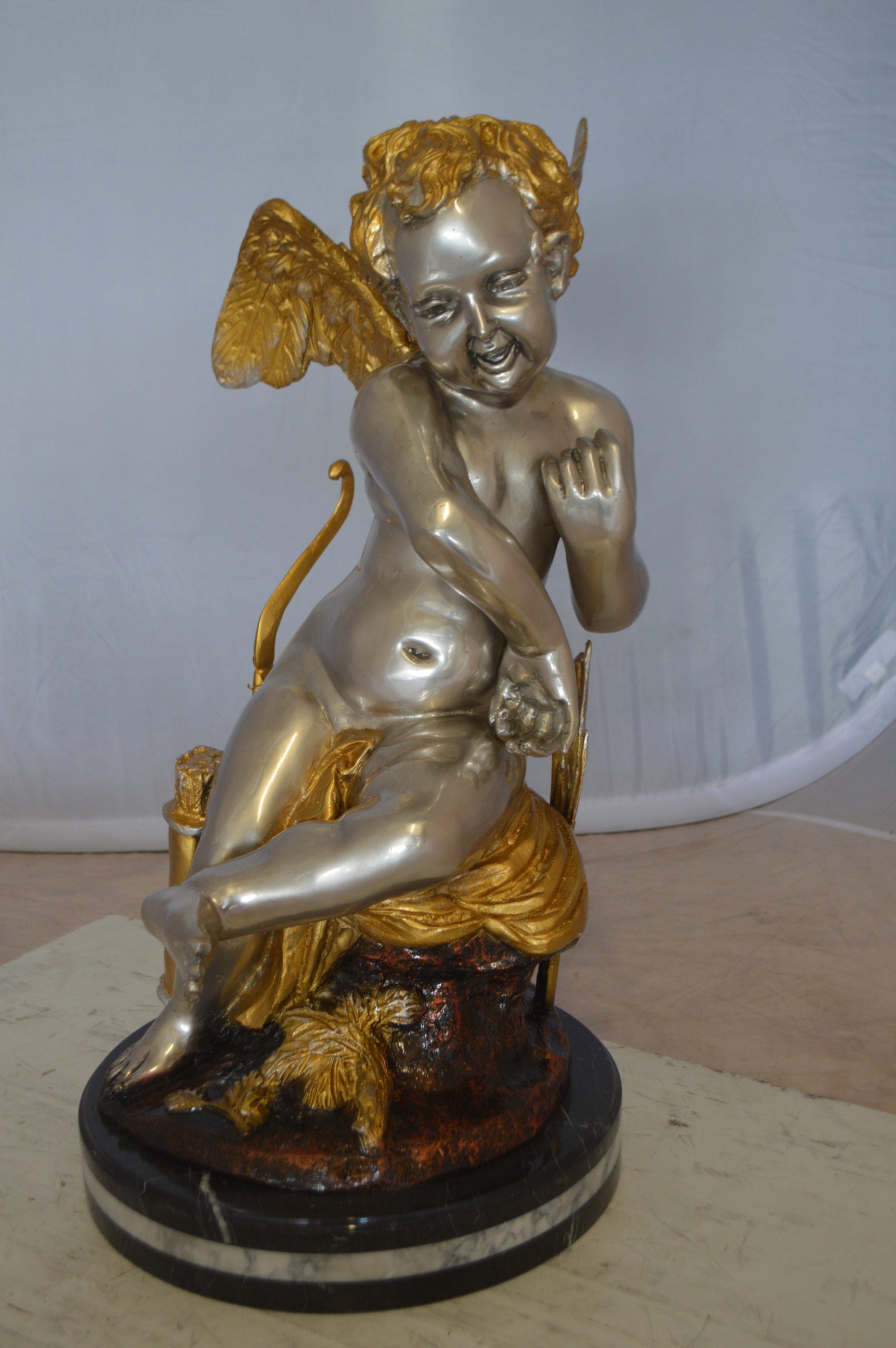 Cupid Girl On A Rock Bronze Statue  -  Size: 20"L x 15"W x 25"H. 
