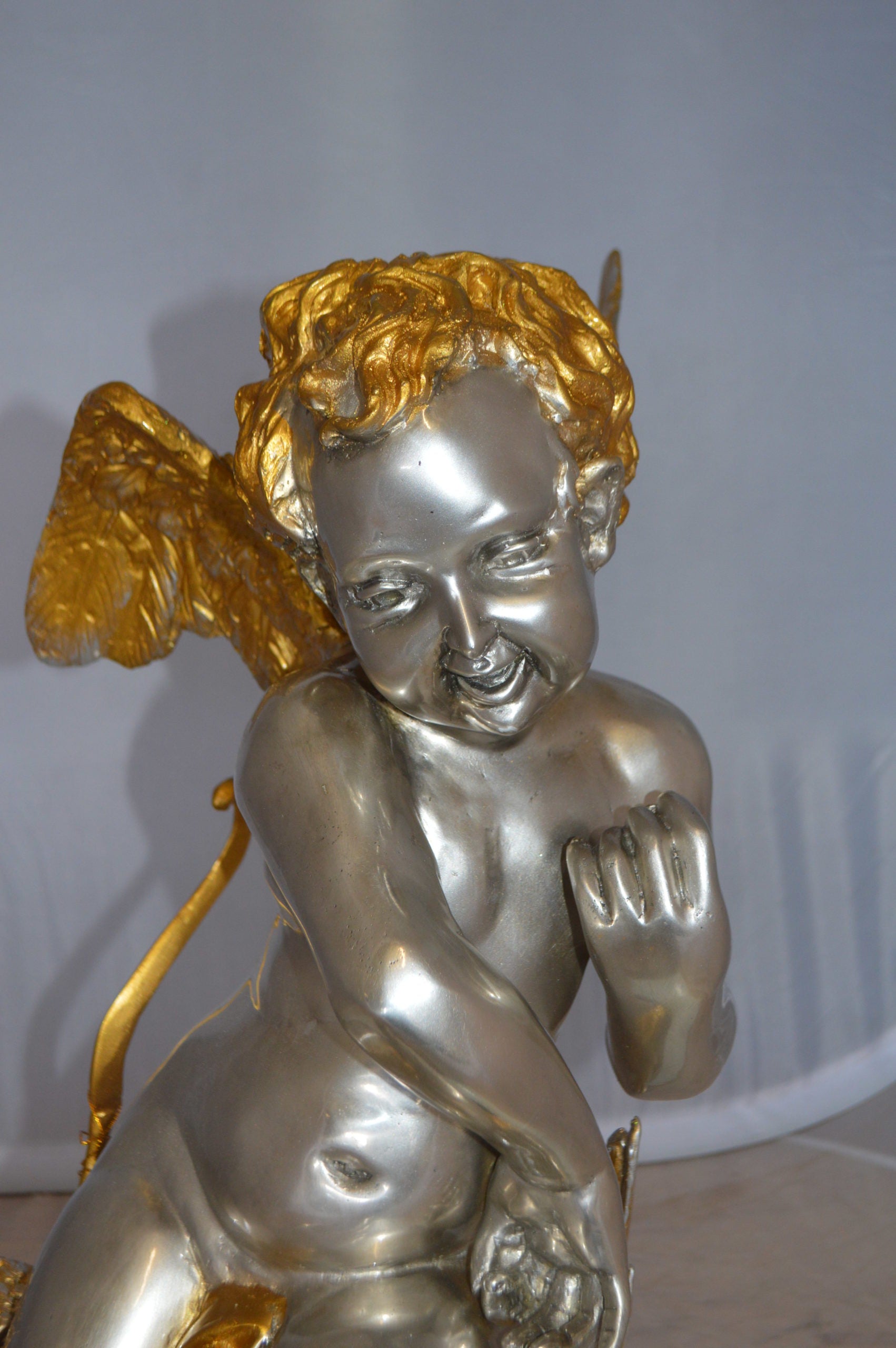 Cupid Girl On A Rock Bronze Statue  -  Size: 20"L x 15"W x 25"H. 
