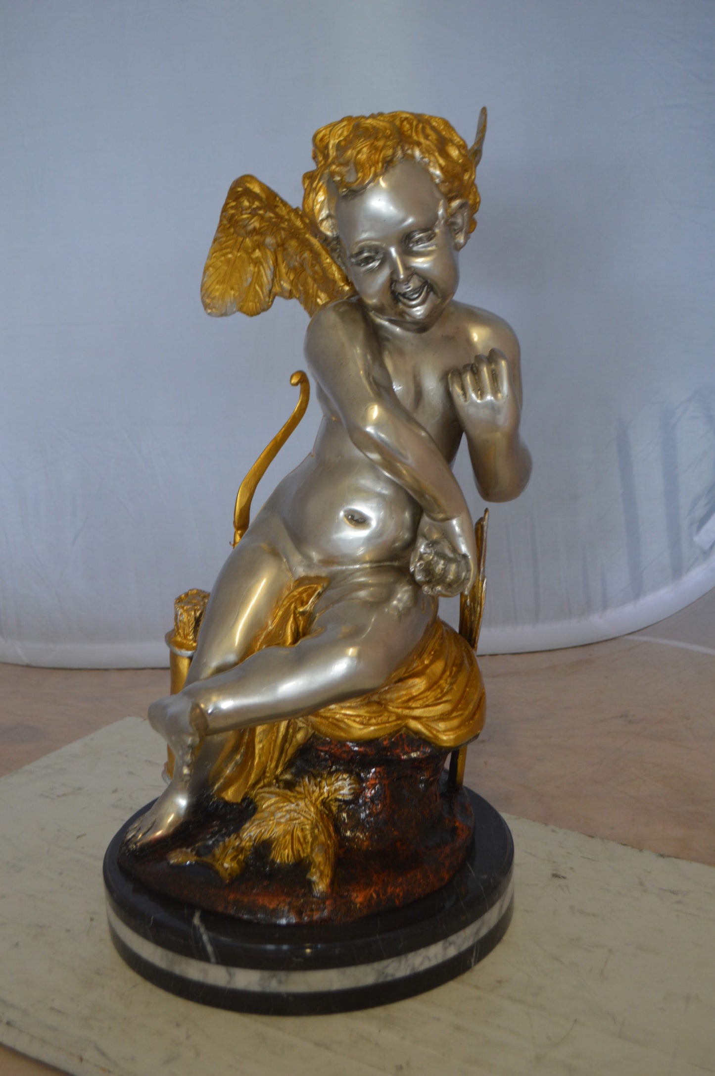 Cupid Girl On A Rock Bronze Statue  -  Size: 20"L x 15"W x 25"H. 