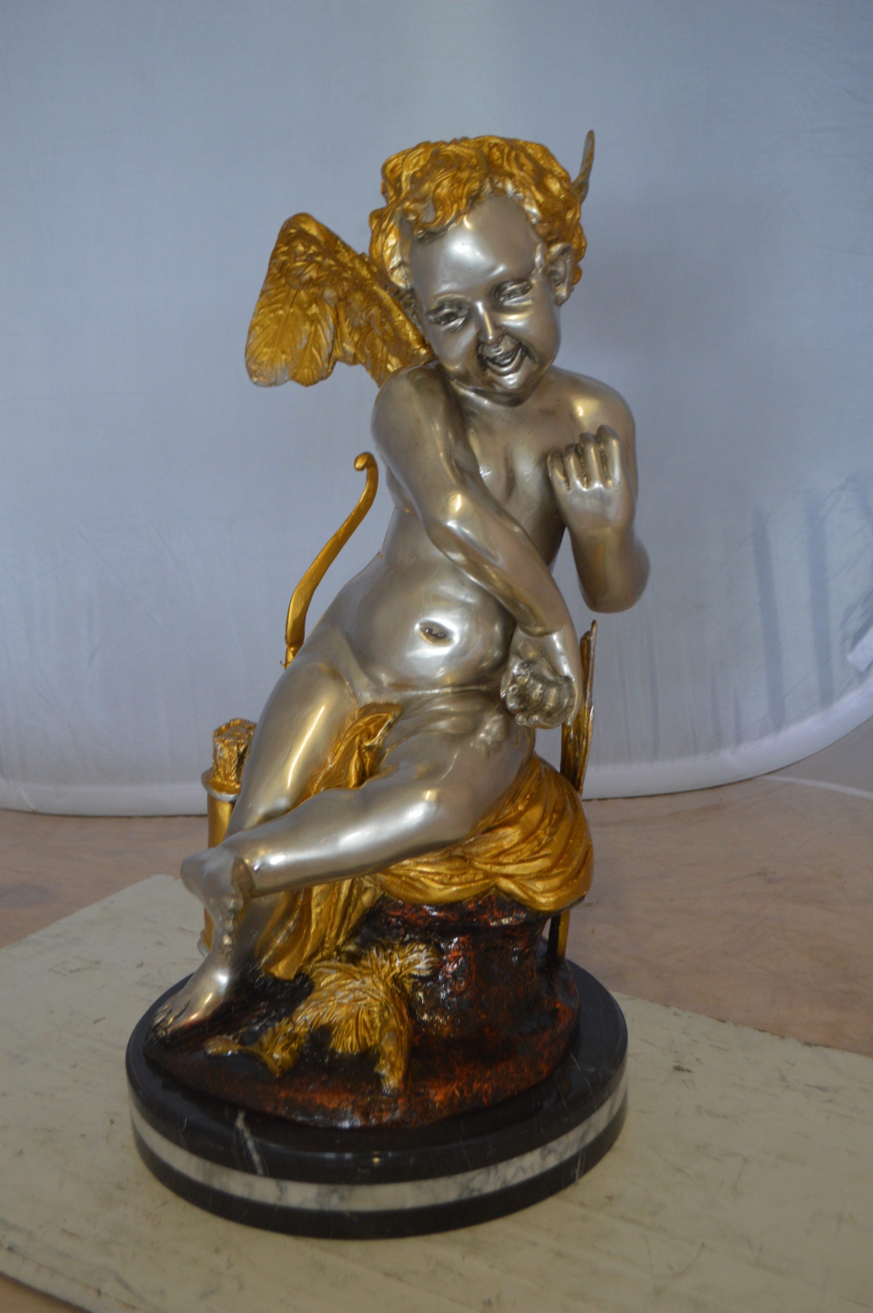 Cupid Girl On A Rock Bronze Statue  -  Size: 20"L x 15"W x 25"H. 