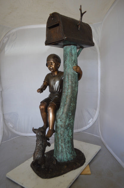 Boy Sitting on a Tree with Mailbox Bronze Statue -  Size: 22"L x 23"W x 49"H. 