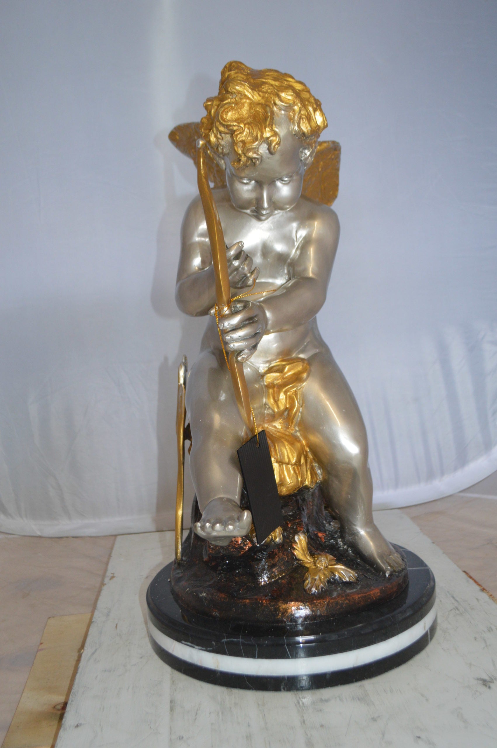 Cupid Boy On A Rock Bronze Statue  -  Size: 20"L x 15"W x 26"H. 