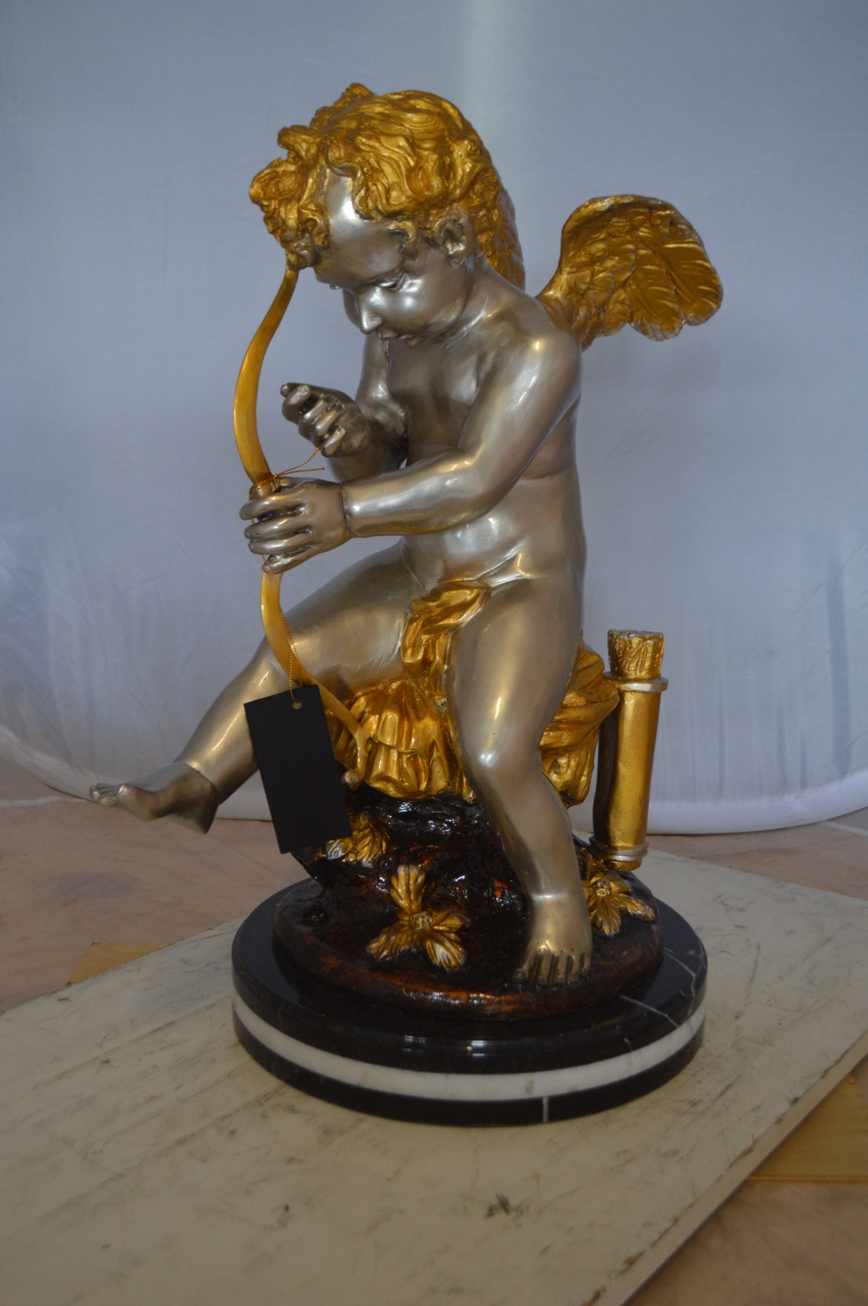 Cupid Boy On A Rock Bronze Statue  -  Size: 20"L x 15"W x 26"H. 