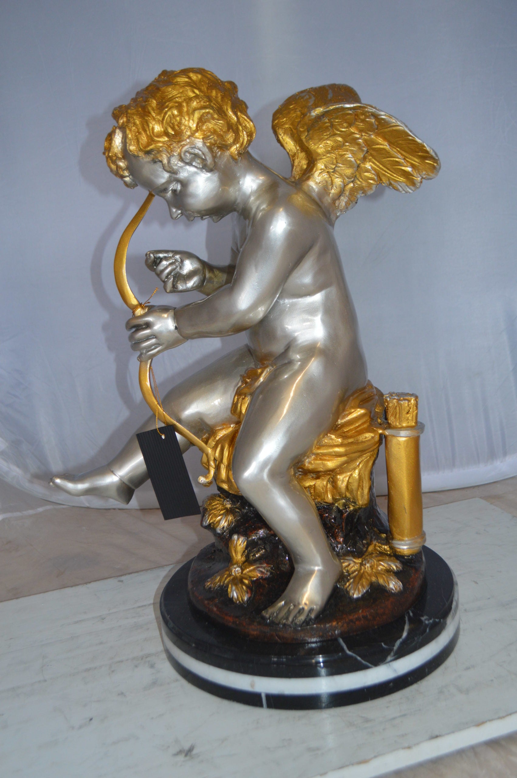 Cupid Boy On A Rock Bronze Statue  -  Size: 20"L x 15"W x 26"H. 