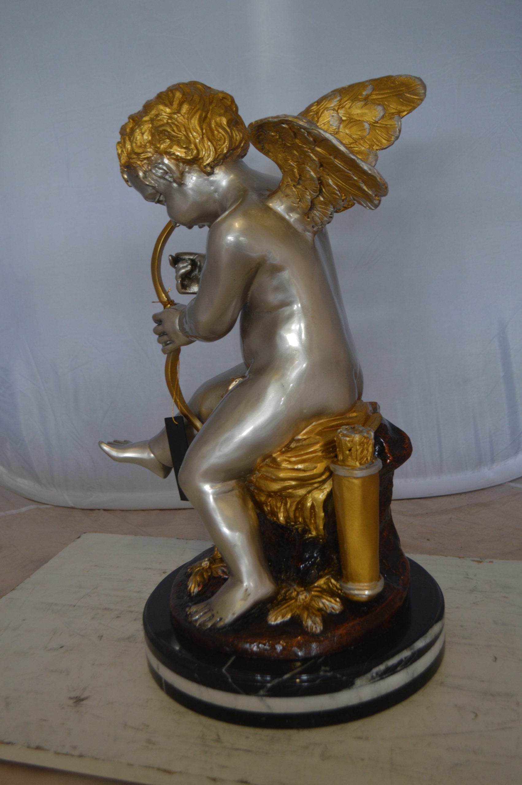 Cupid Boy On A Rock Bronze Statue  -  Size: 20"L x 15"W x 26"H. 
