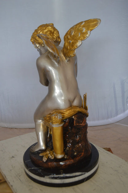 Cupid Boy On A Rock Bronze Statue  -  Size: 20"L x 15"W x 26"H. 