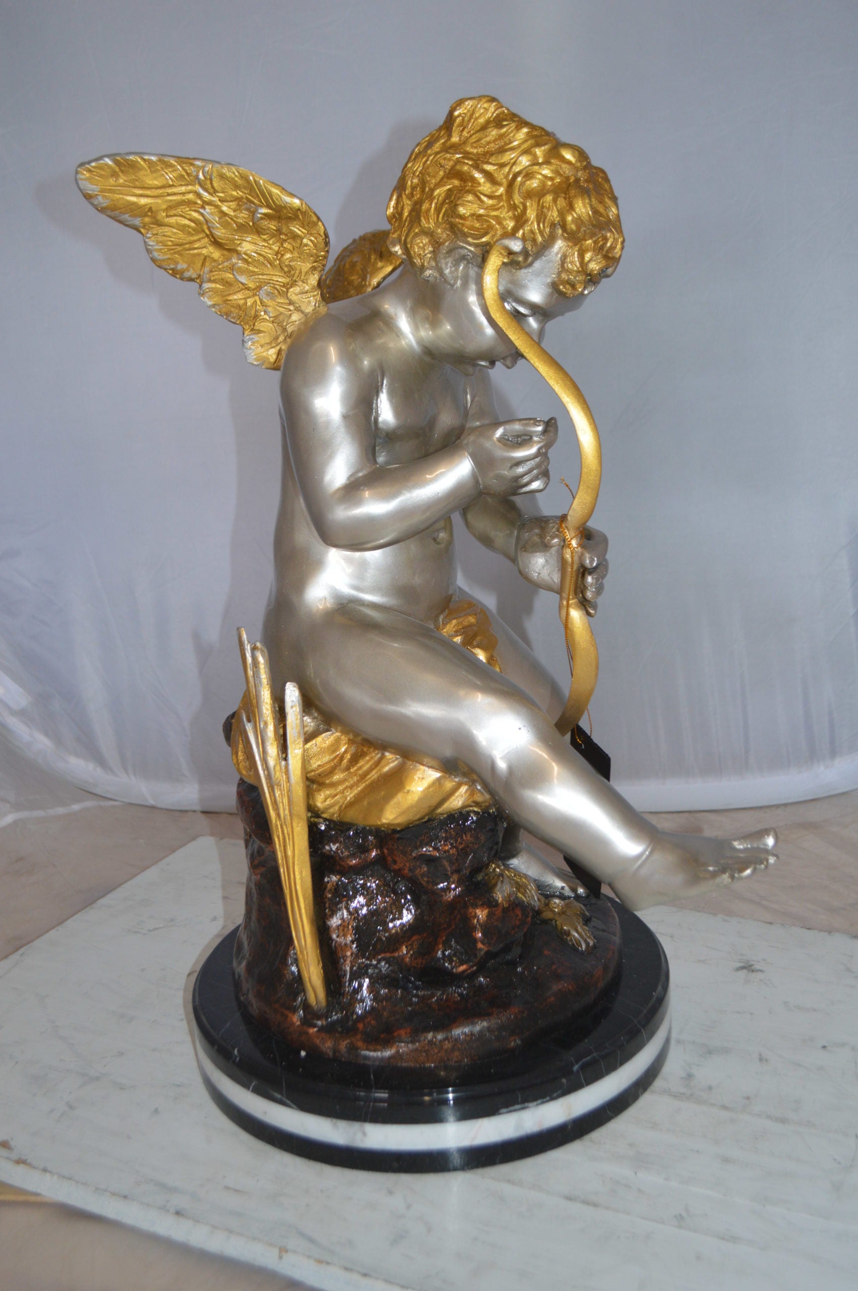 Cupid Boy On A Rock Bronze Statue  -  Size: 20"L x 15"W x 26"H. 