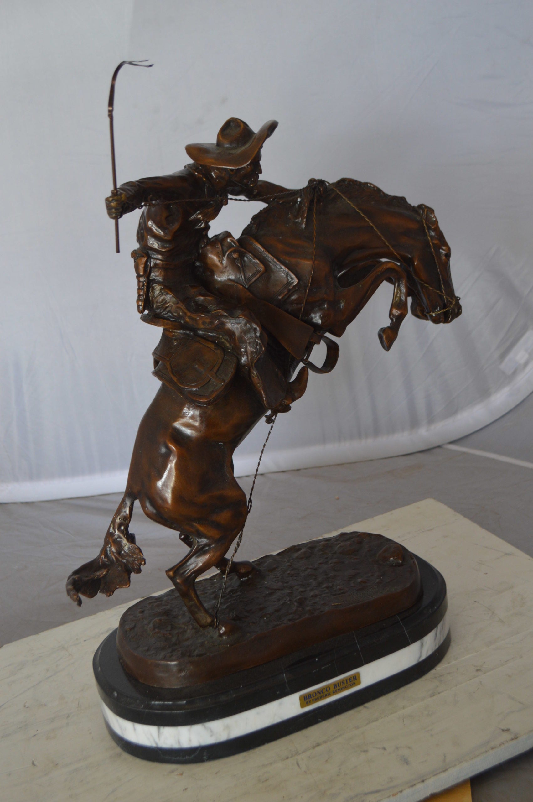Bronco Buster by Remington Bronze Statue on a triple marble -  21"x 10"x 26"H. 