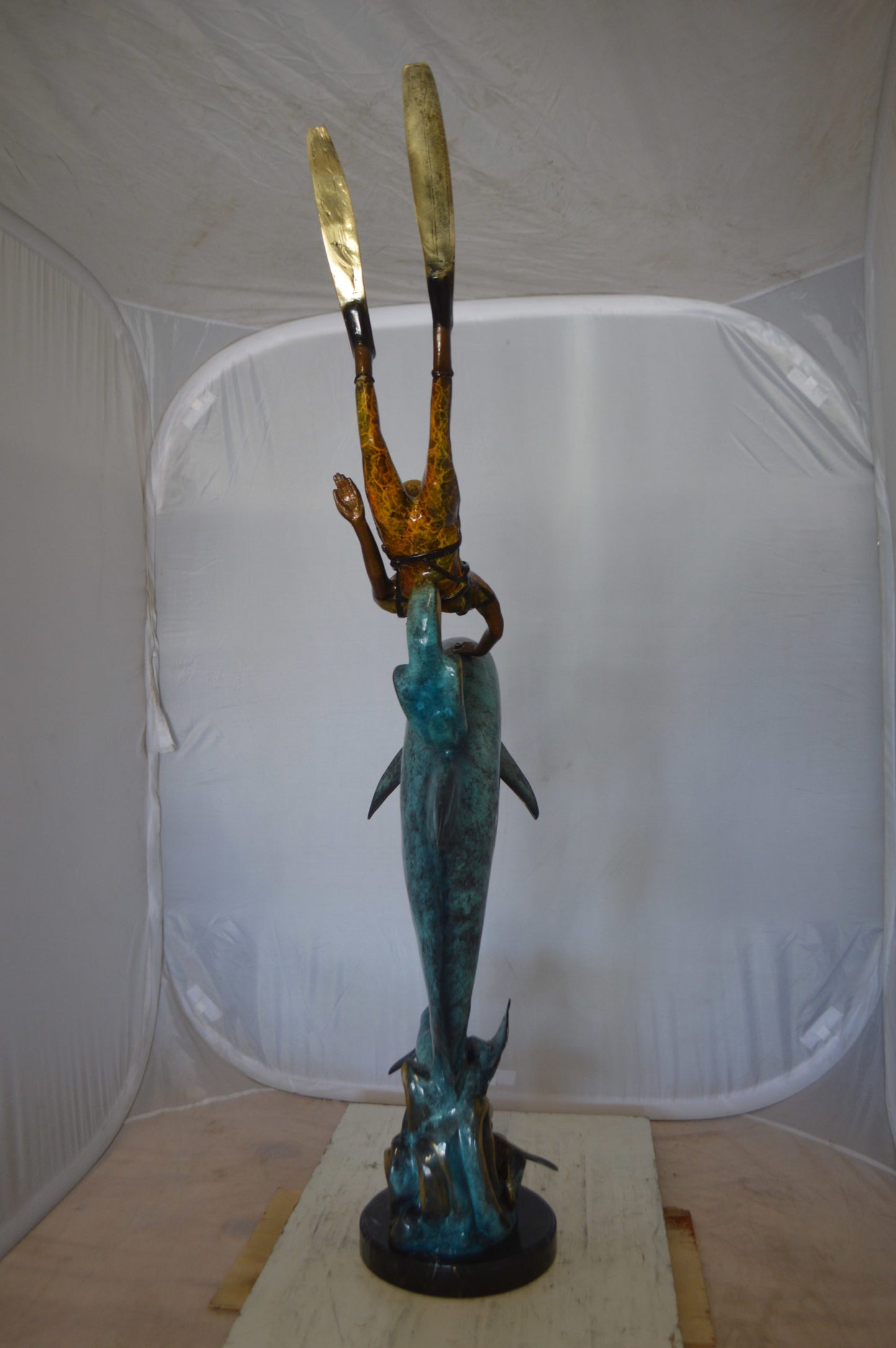 Diver With Dolphin Bronze Statue -  Size: 10"L x 30"W x 49"H. 