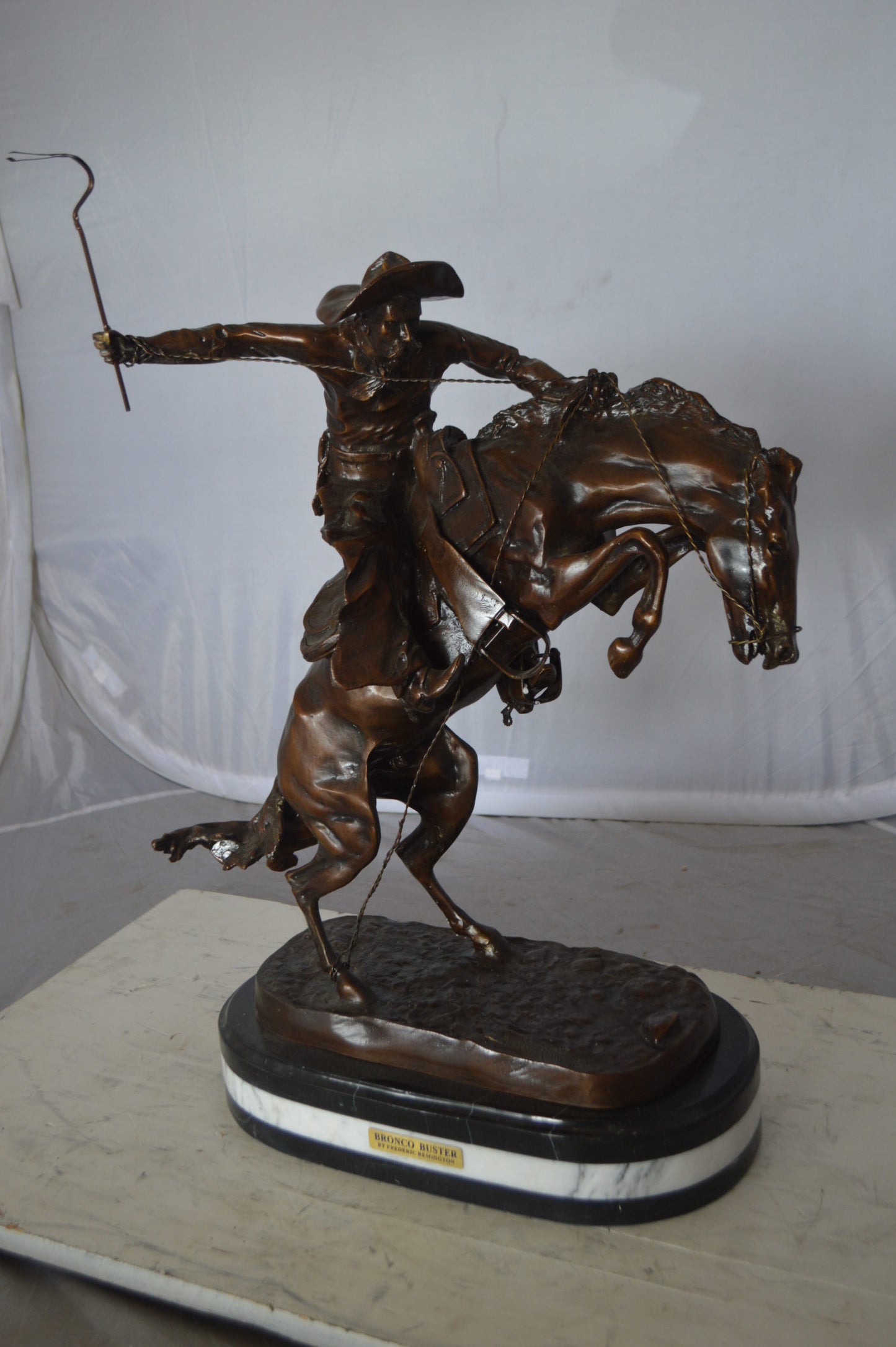Bronco Buster by Remington Bronze Statue on a triple marble -  21"x 10"x 26"H. 