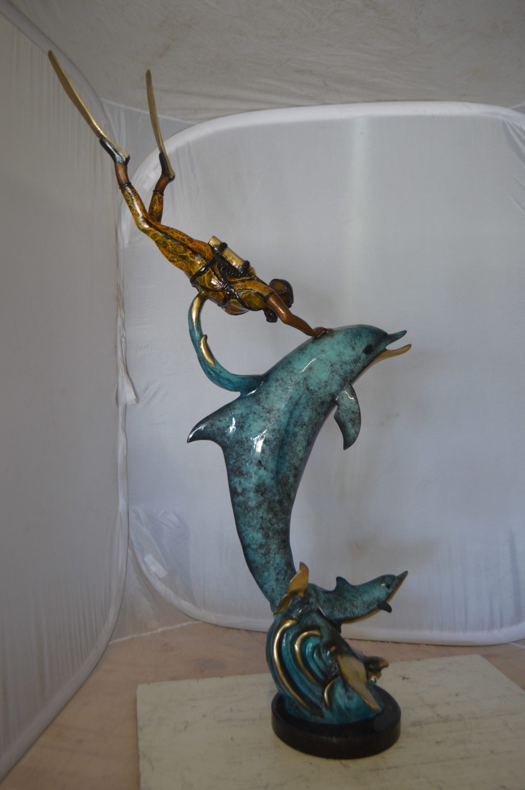 Diver With Dolphin Bronze Statue -  Size: 10"L x 30"W x 49"H. 