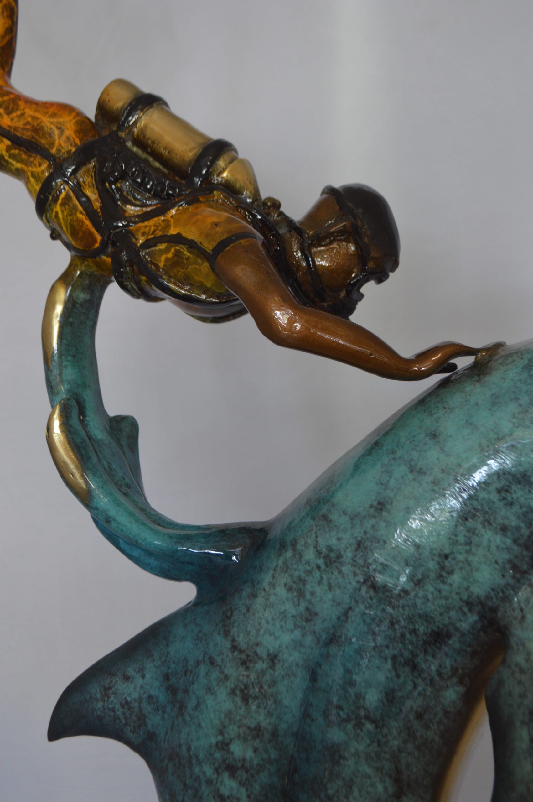 Diver With Dolphin Bronze Statue -  Size: 10"L x 30"W x 49"H. 