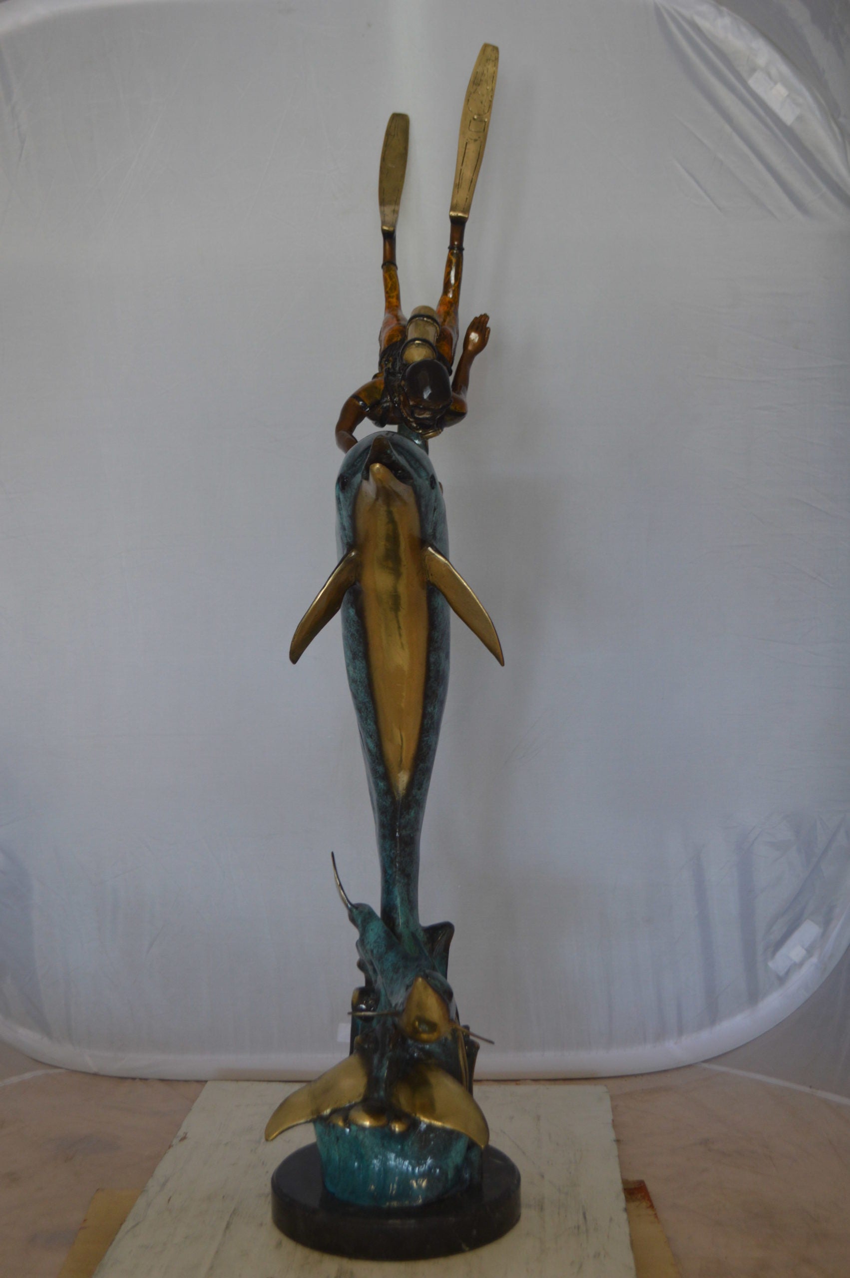 Diver With Dolphin Bronze Statue -  Size: 10"L x 30"W x 49"H. 