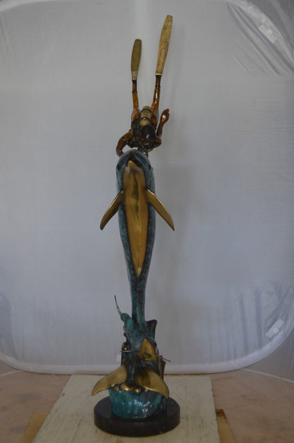 Diver With Dolphin Bronze Statue -  Size: 10"L x 30"W x 49"H. 