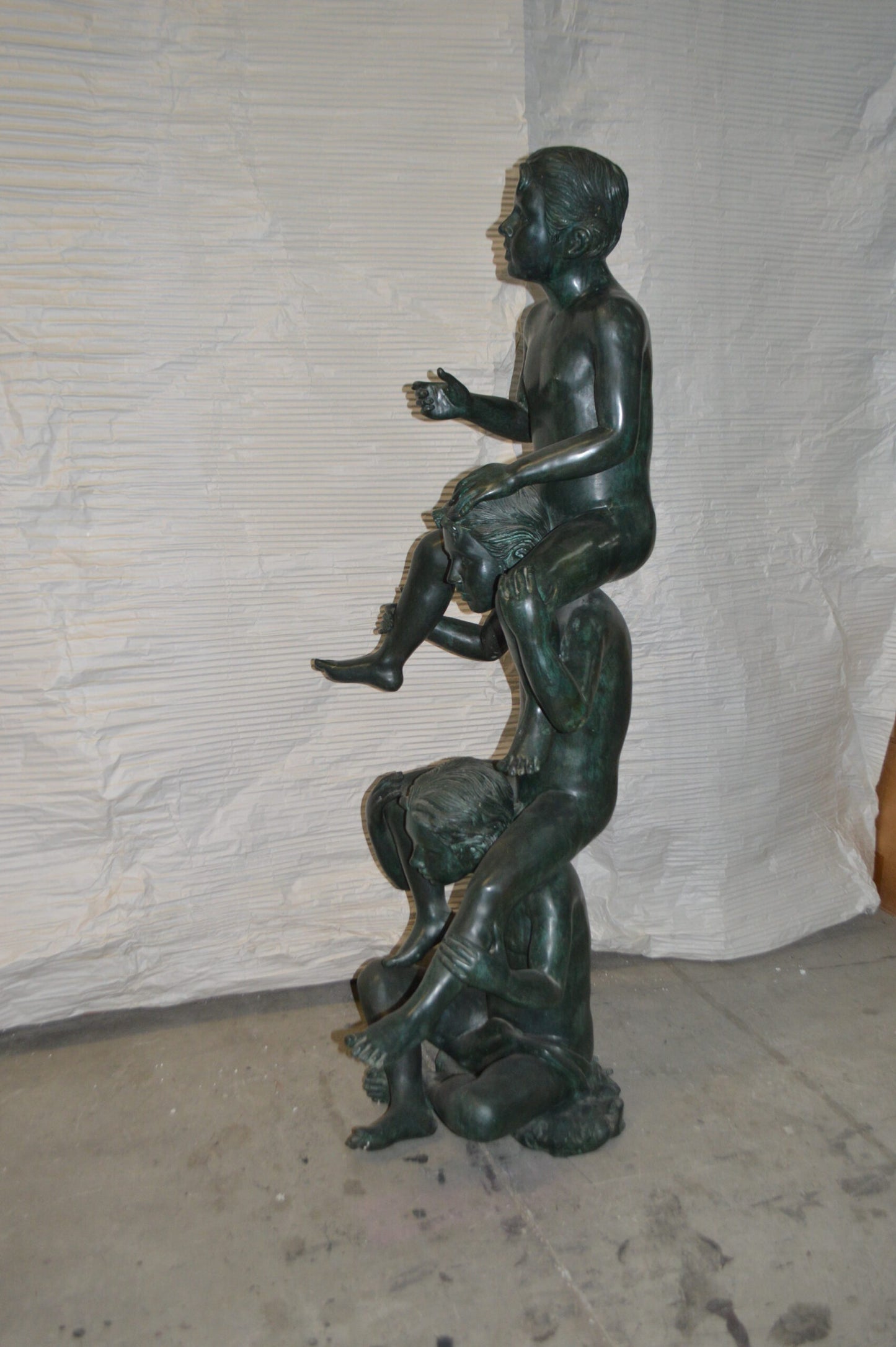Three kids on Each other fountain Bronze Statue -  Size: 20"L x 27"W x 64"H.