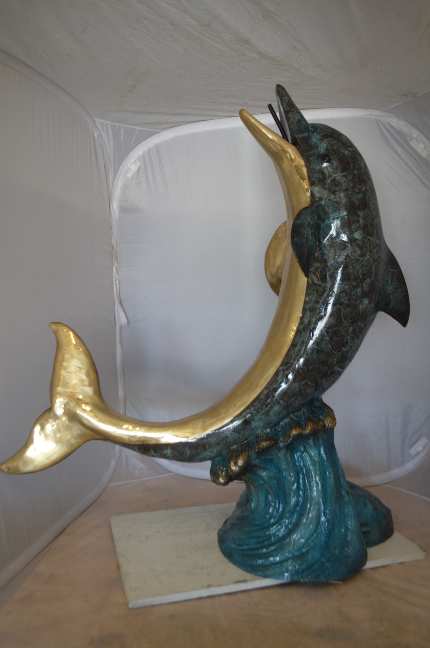 Single Dolphin  On Wave Fountain Bronze Statue -  Size: 48"L x 24"W x 53"H. 