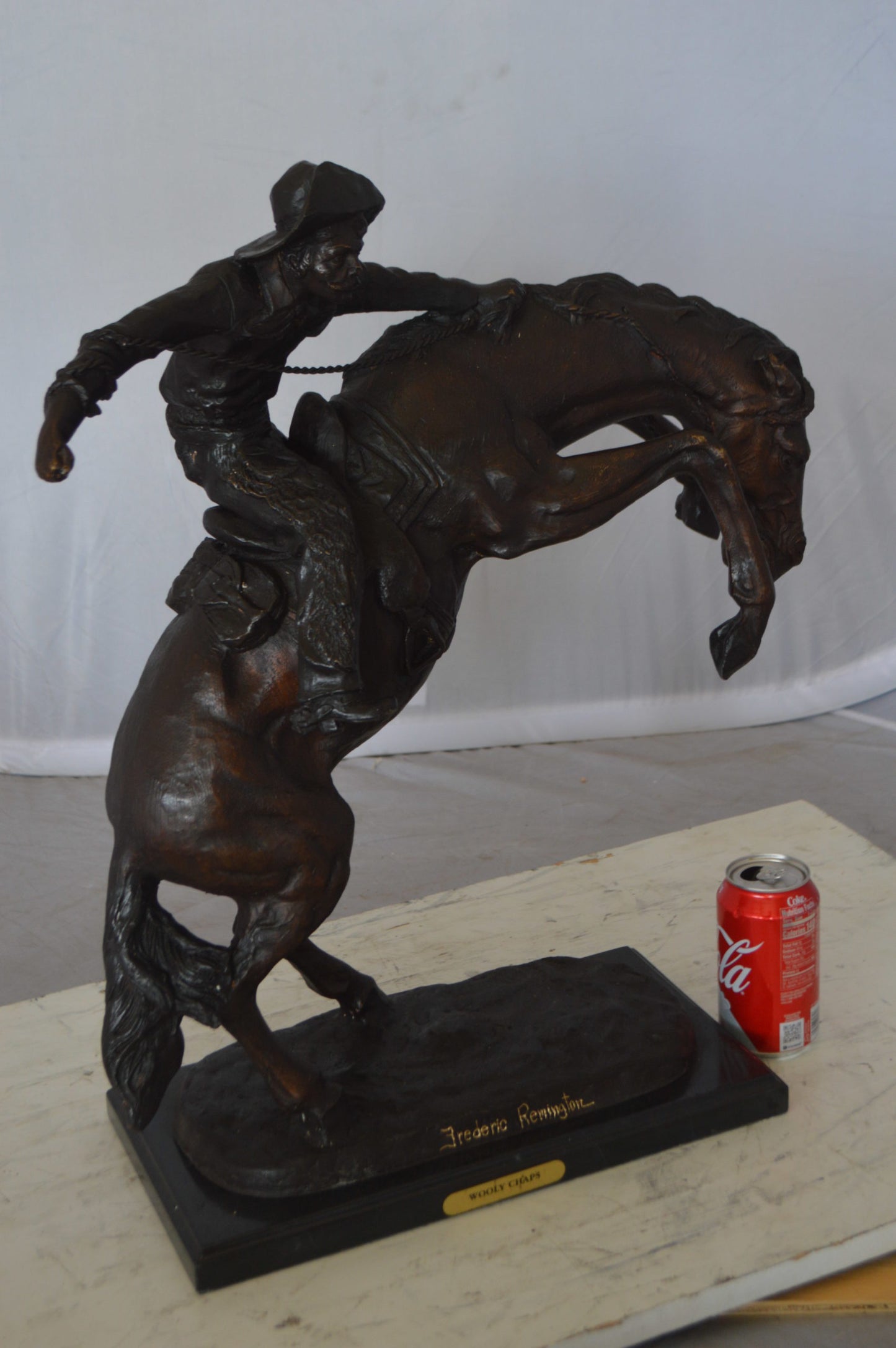 Wooly Chaps Bronze Statue by Remington -  Size: 19"L x 11"W x 23"H. 