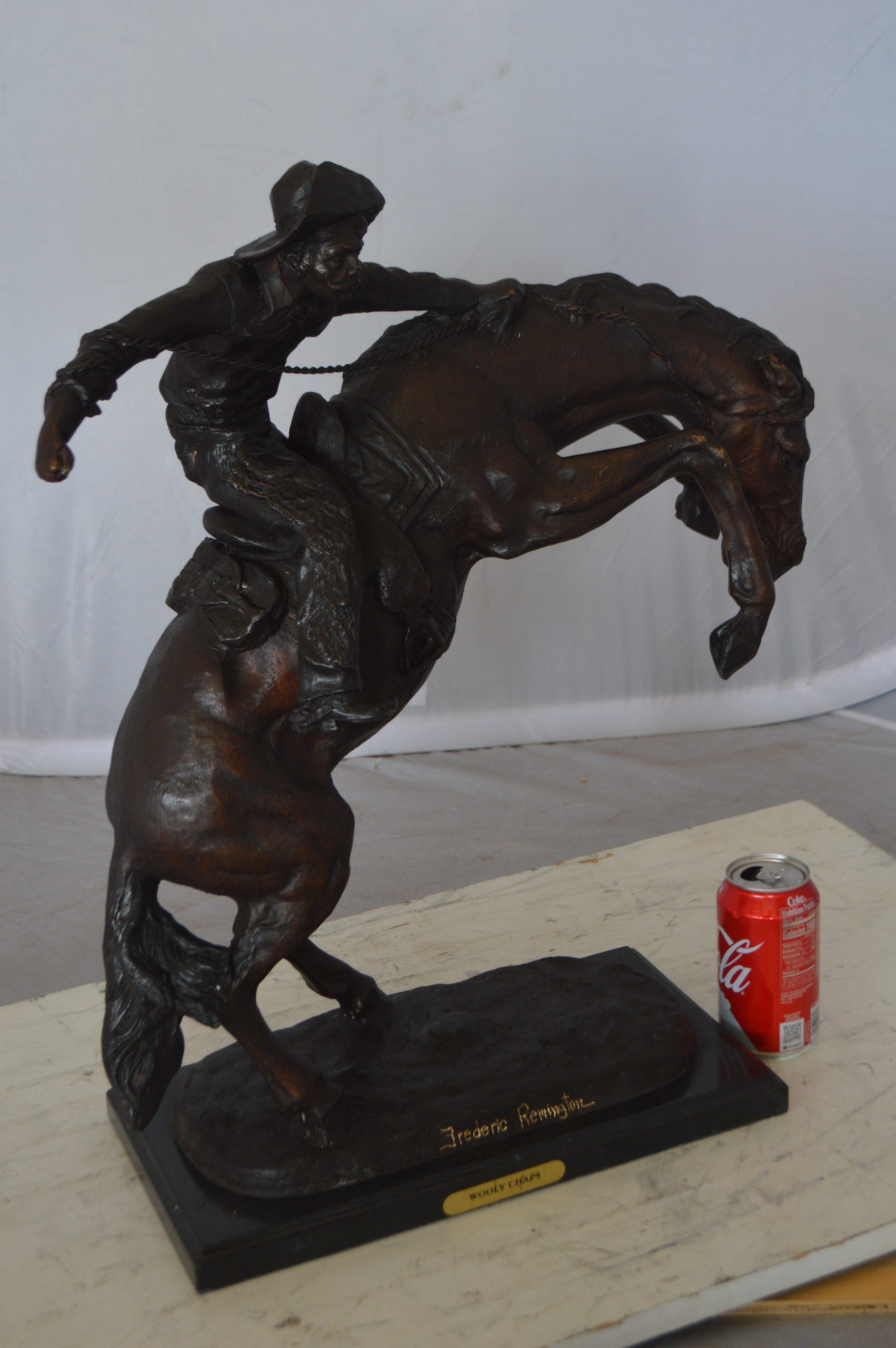 Wooly Chaps Bronze Statue by Remington -  Size: 19"L x 11"W x 23"H. 