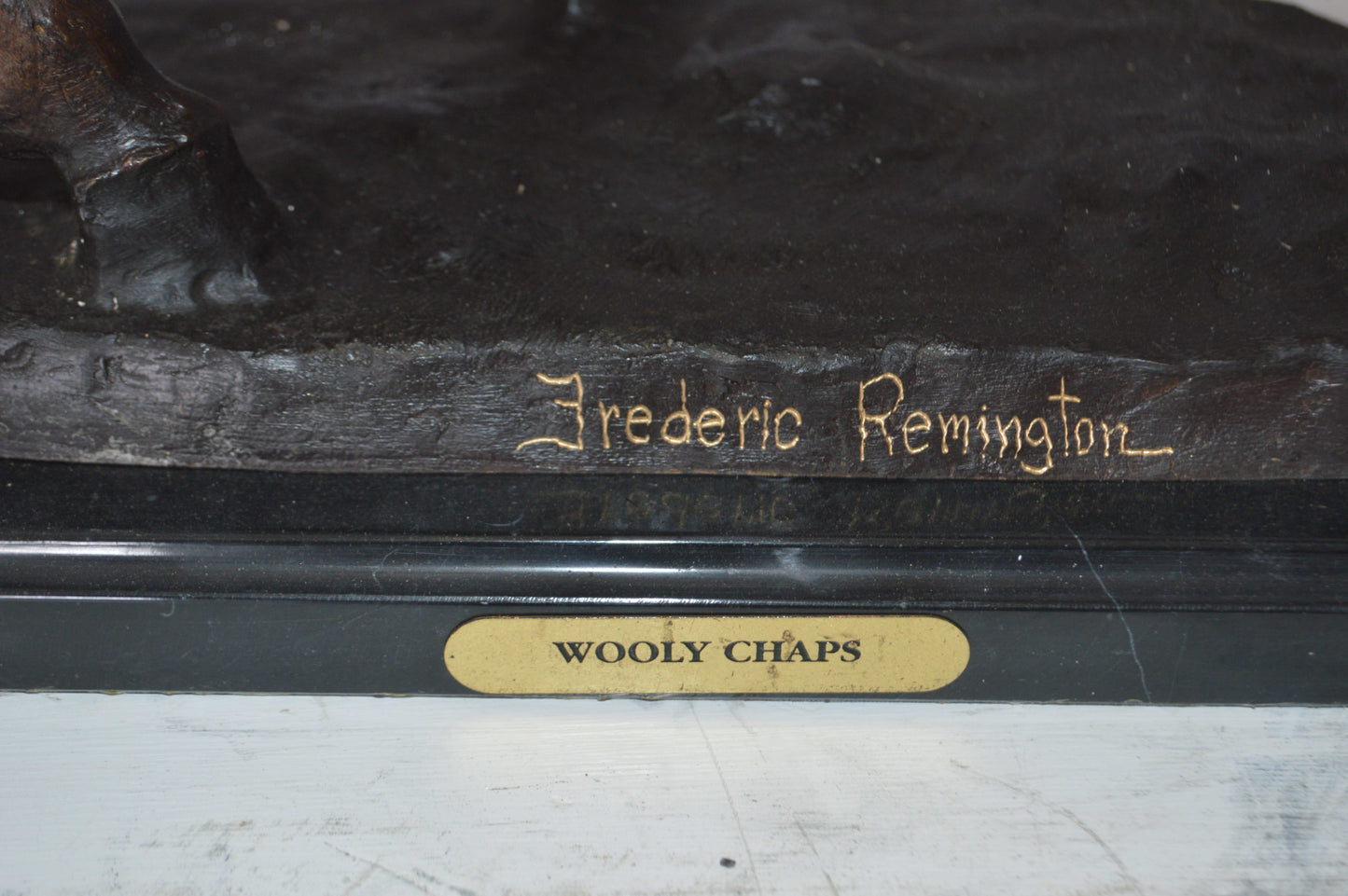 Wooly Chaps Bronze Statue by Remington -  Size: 19"L x 11"W x 23"H. 