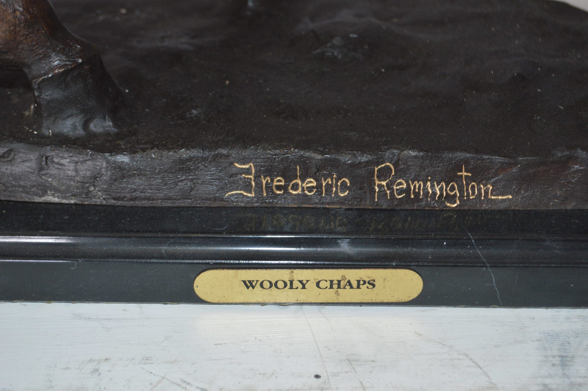 Wooly Chaps Bronze Statue by Remington -  Size: 19"L x 11"W x 23"H. 