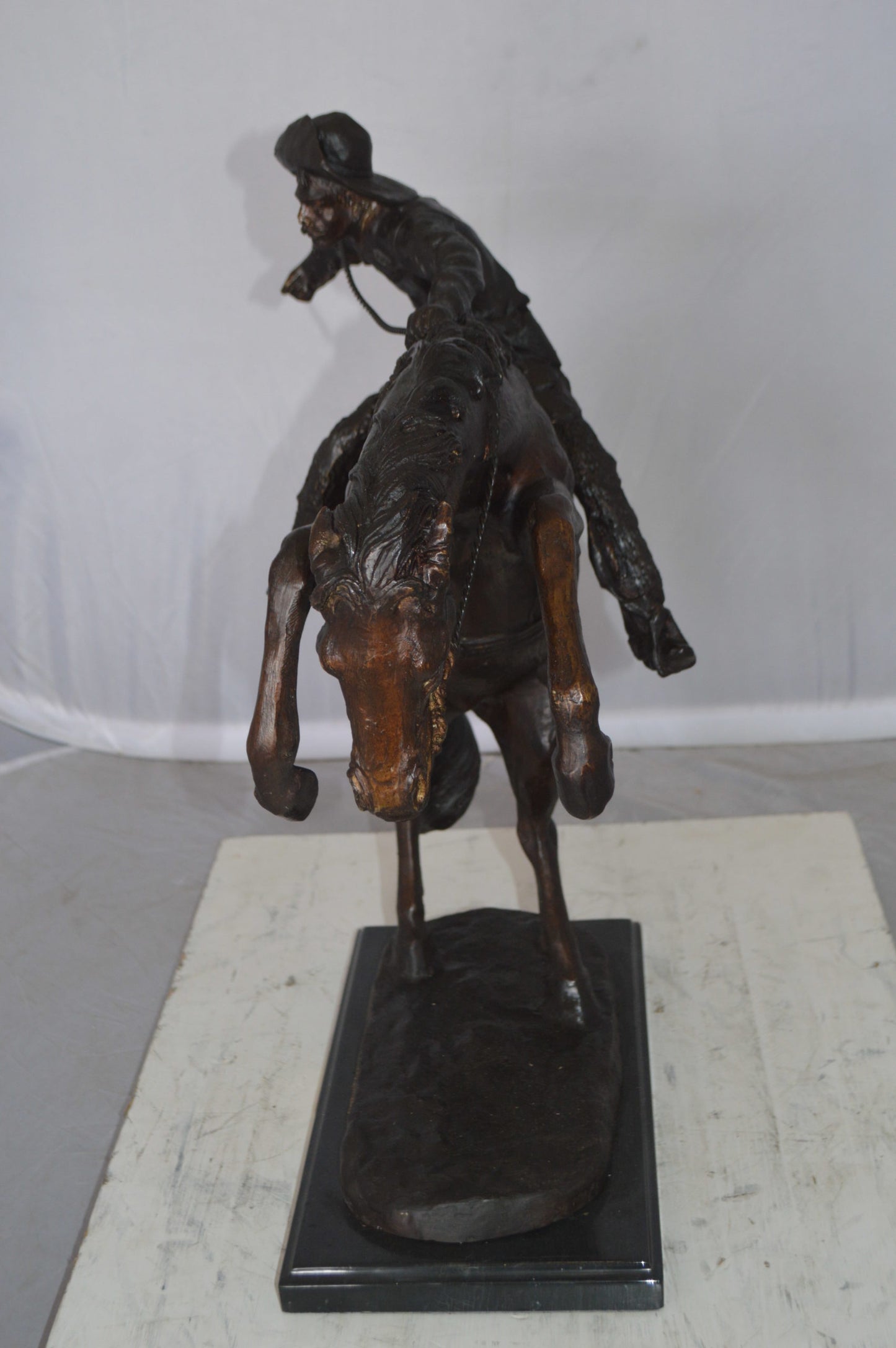 Wooly Chaps Bronze Statue by Remington -  Size: 19"L x 11"W x 23"H. 