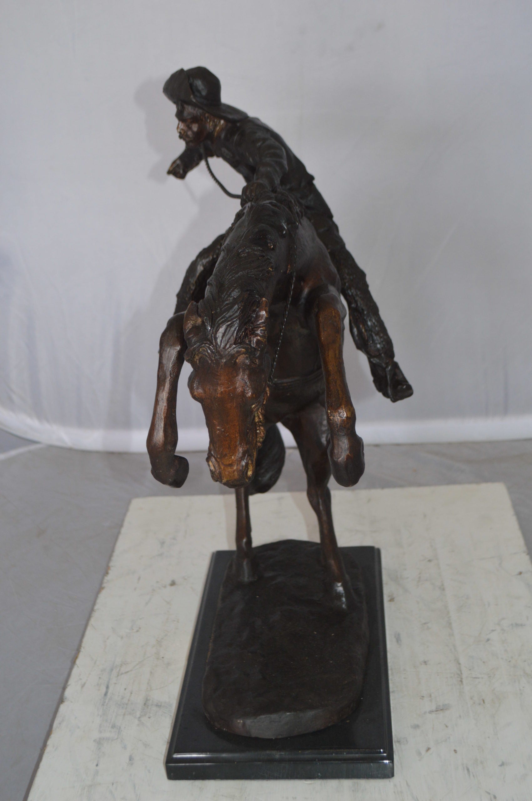 Wooly Chaps Bronze Statue by Remington -  Size: 19"L x 11"W x 23"H. 